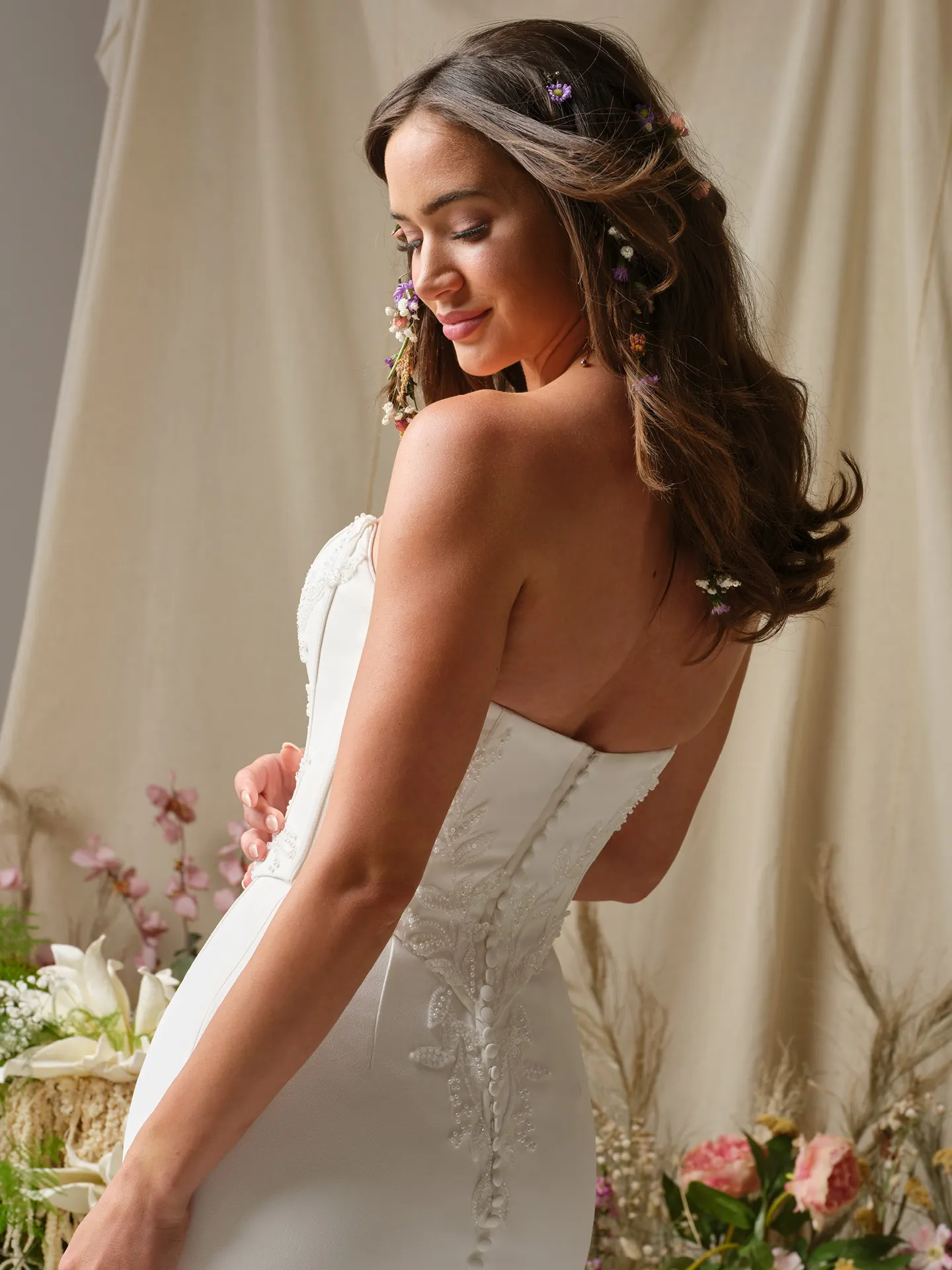 Rebecca Ingram Terry side view, beaded back sheath wedding dress with floral decor