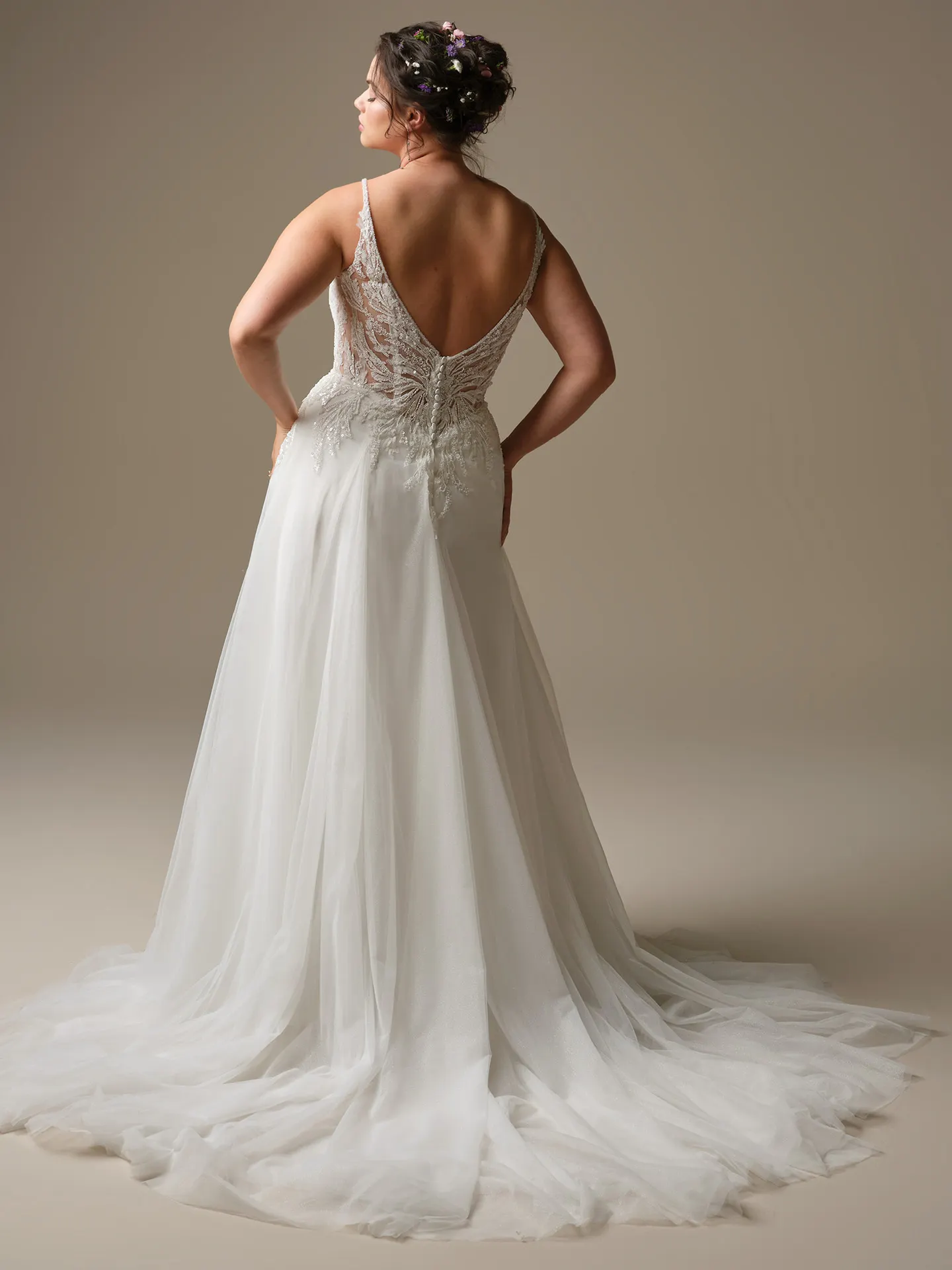 Rebecca Ingram Valarie back view lace A-line wedding dress with a plunging V-neck and side slit