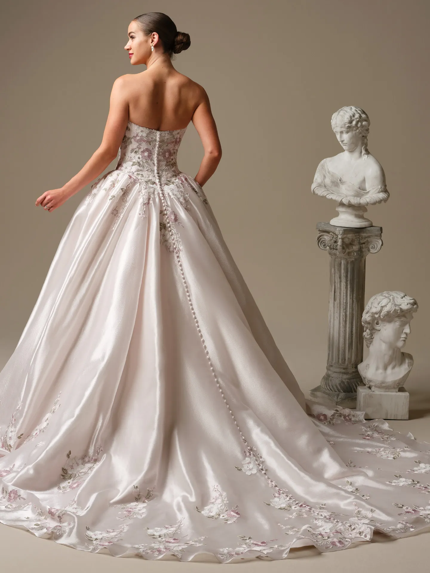 Maggie Sottero ballgown, back view with floral lace and button details.