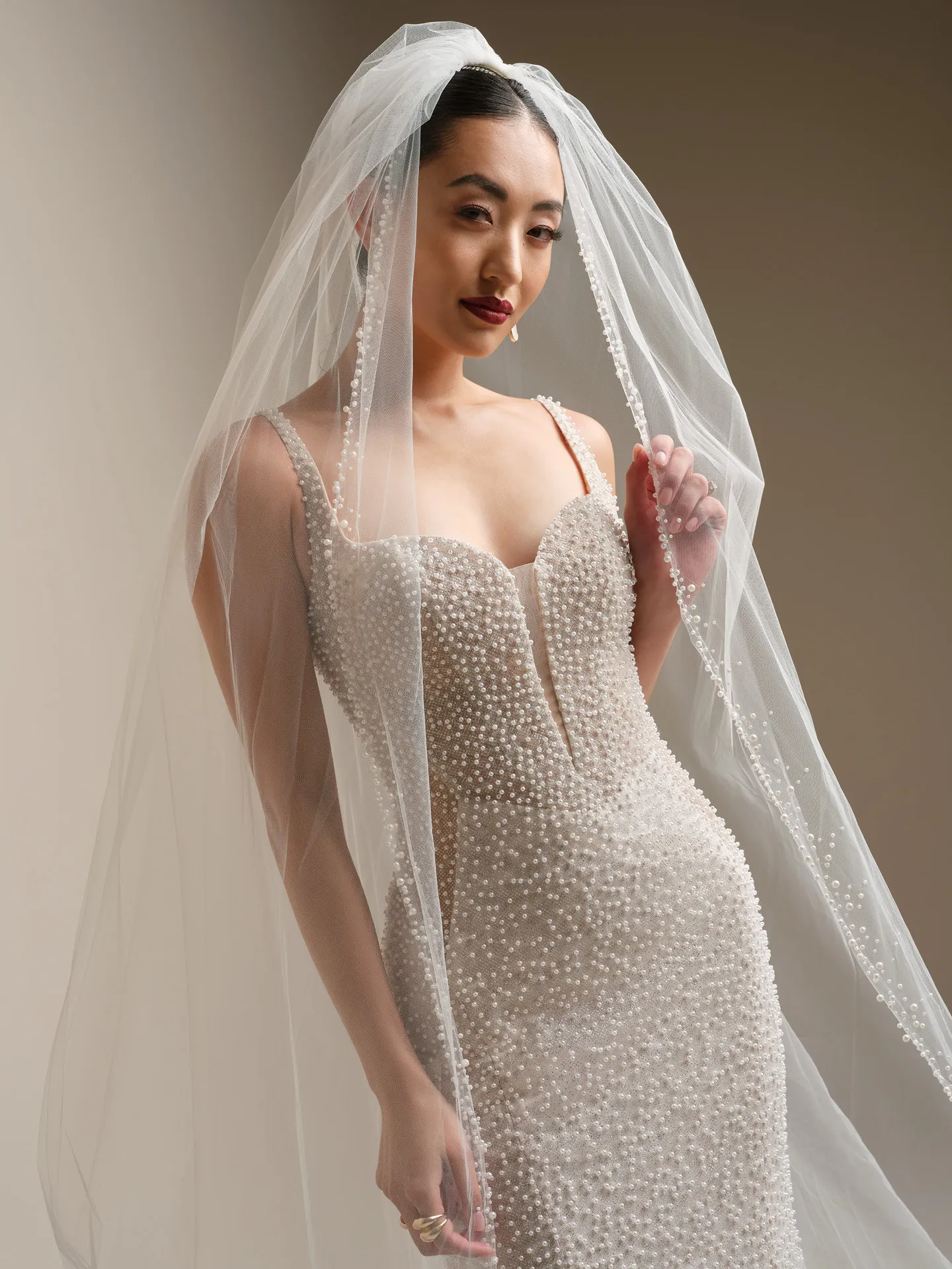Sottero and Midgley Cooper, front view with veil and pearl glitter detail.