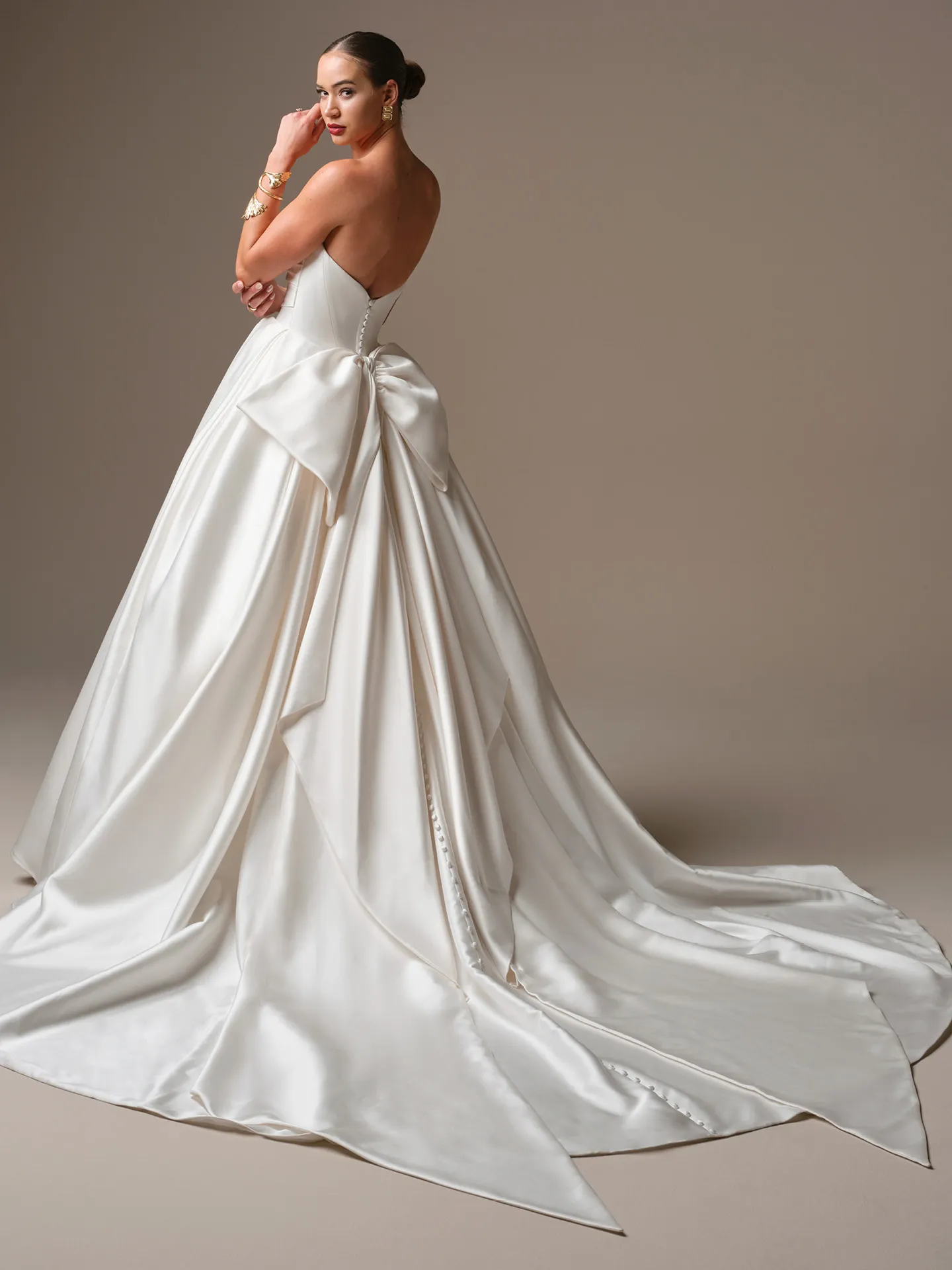Sottero and Midgley Elias, back view satin ballgown with large bow.