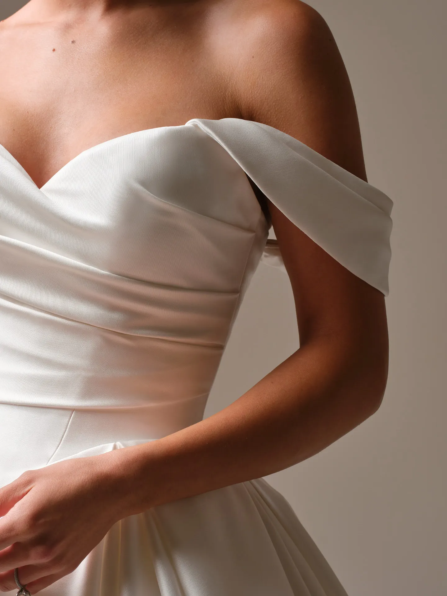 Sottero and Midgley Elias satin gown, side view with cap sleeves.