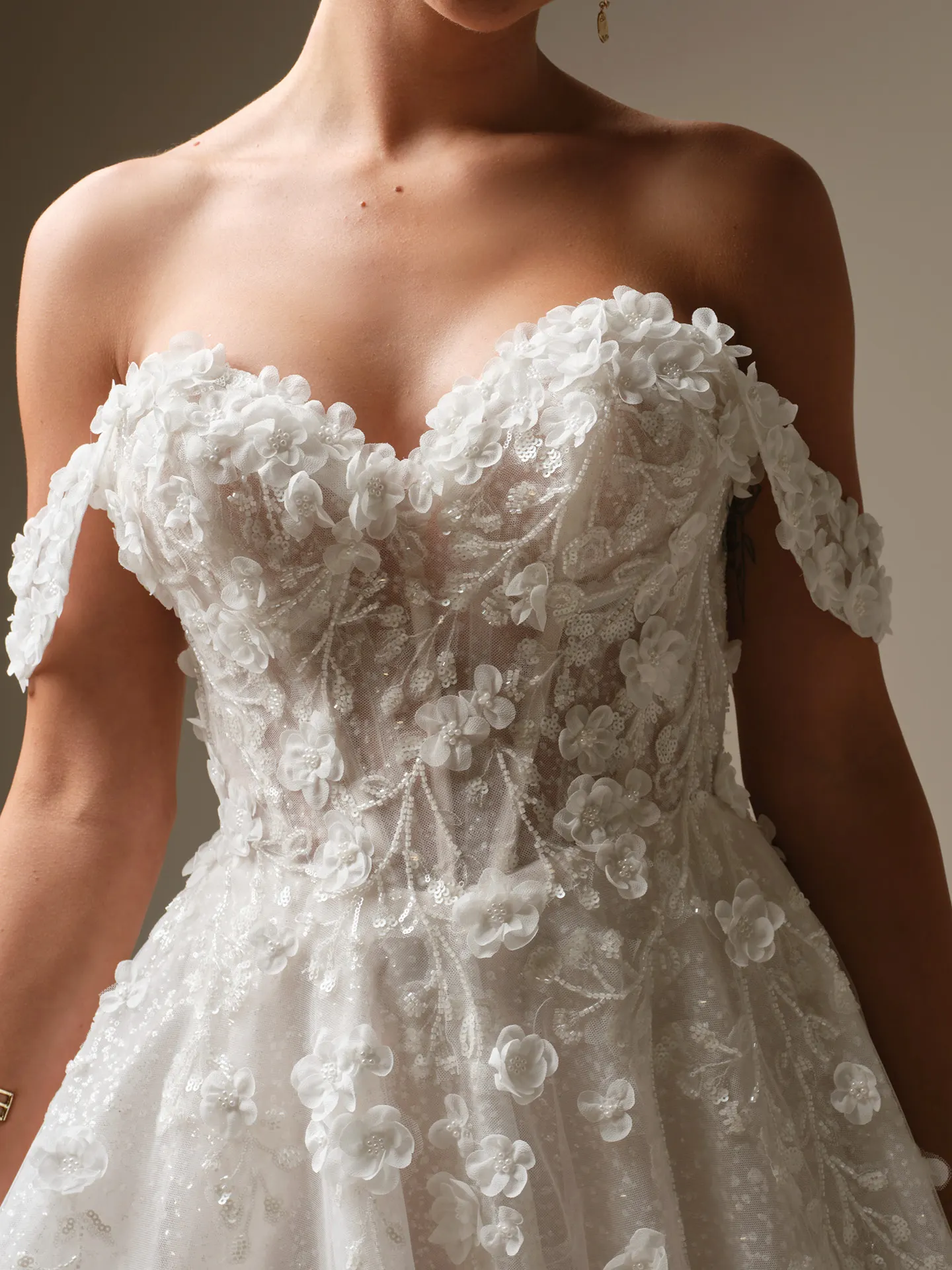 Sottero and Midgley Kalinda, front view with 3-D flowers and beaded cap-sleeves.