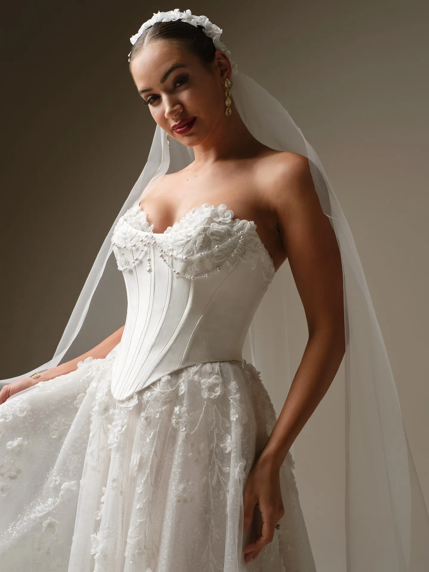 Sottero and Midgley Kalinda dress, front view with 3-D flower detail and cathedral veil.