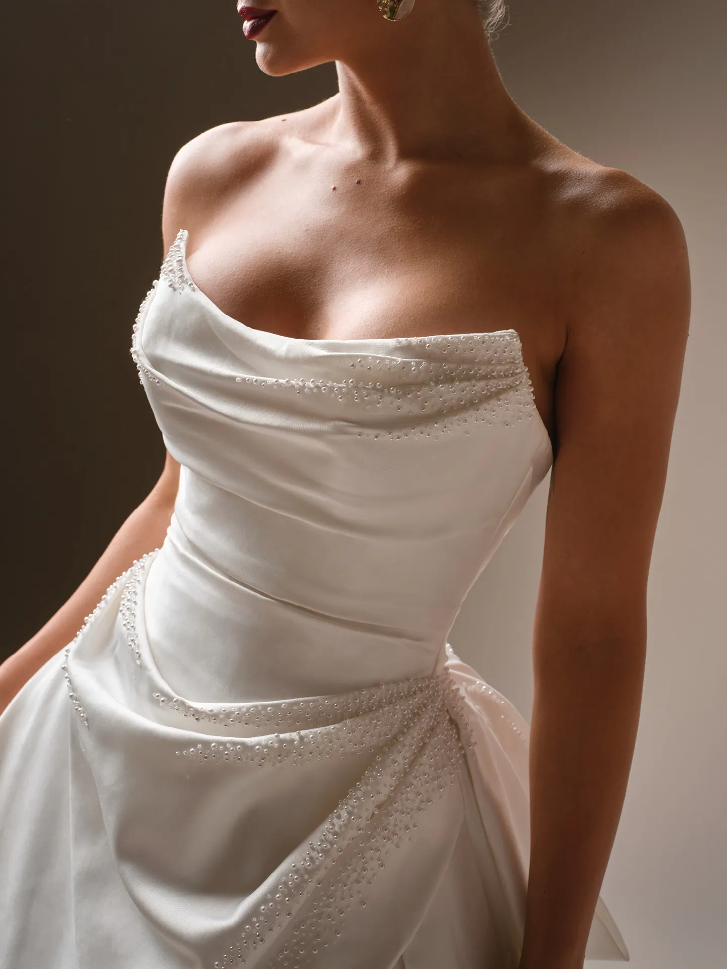 Sottero and Midgley Kincaid satin ballgown, side view with beaded details.