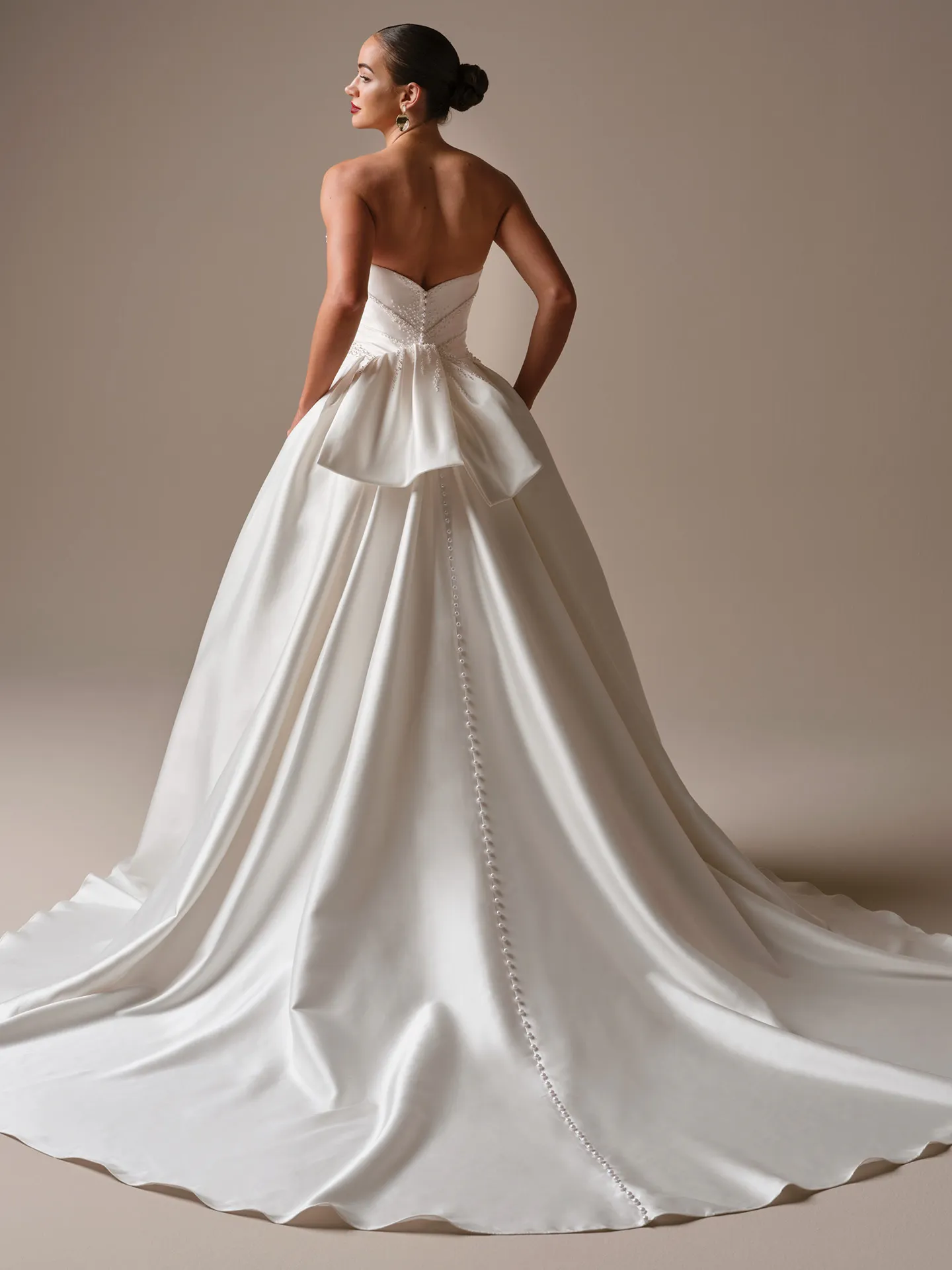 Sottero and Midgley Kincaid, back view satin ballgown wedding dress with buttons.