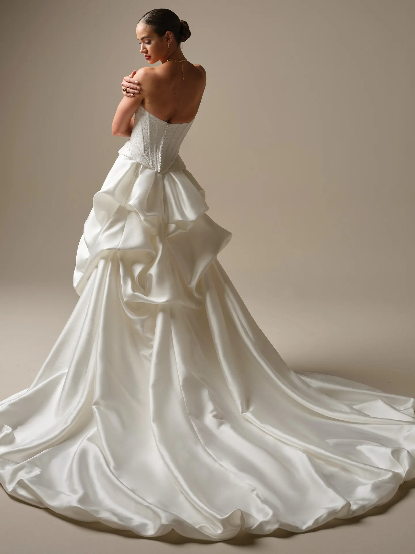 Sottero and Midgley Lassen, back view strapless sheath wedding dress with ruffled satin train.