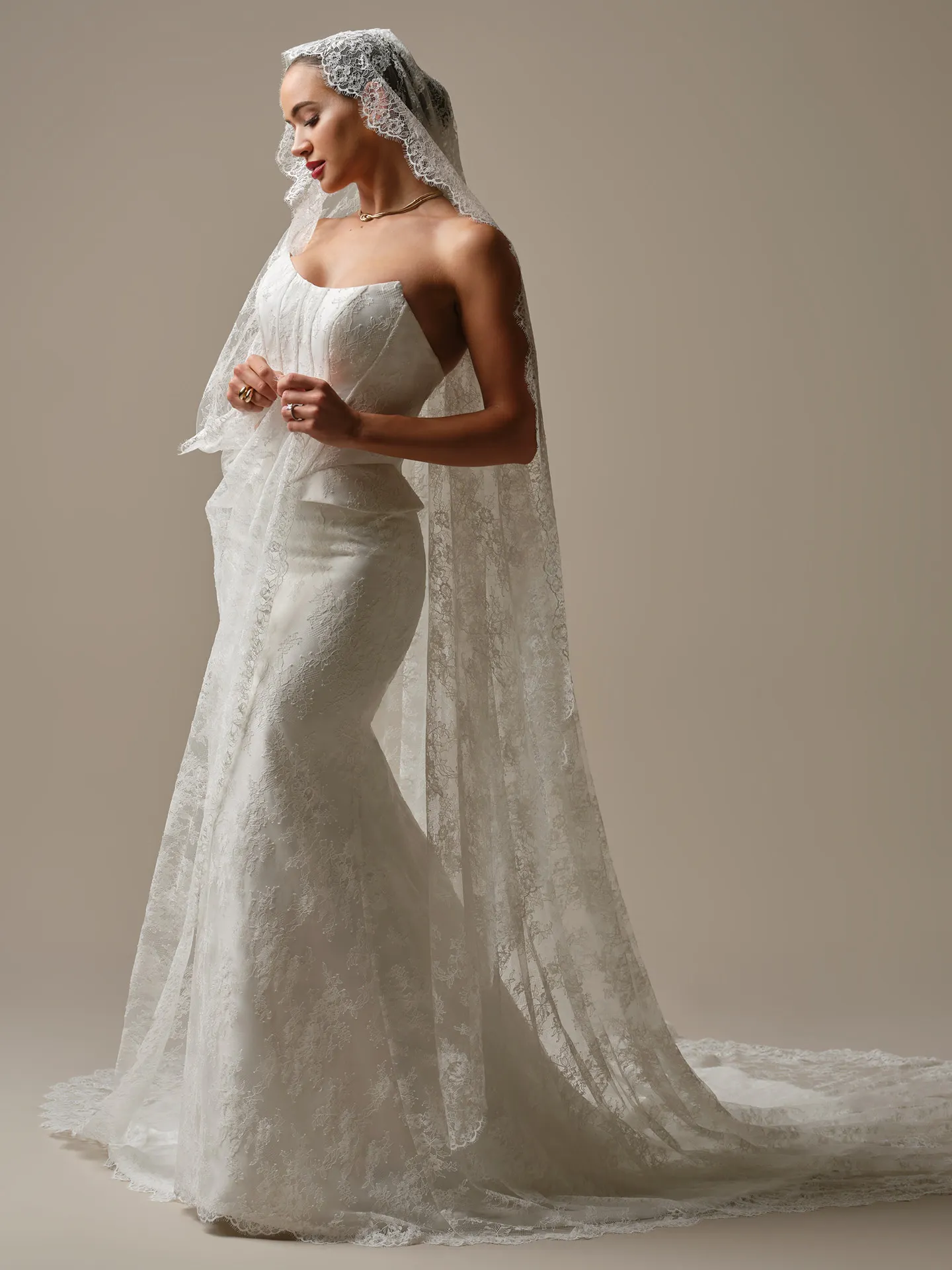 Sottero and Midgley Lassen, side view strapless lace sheath wedding dress with veil.