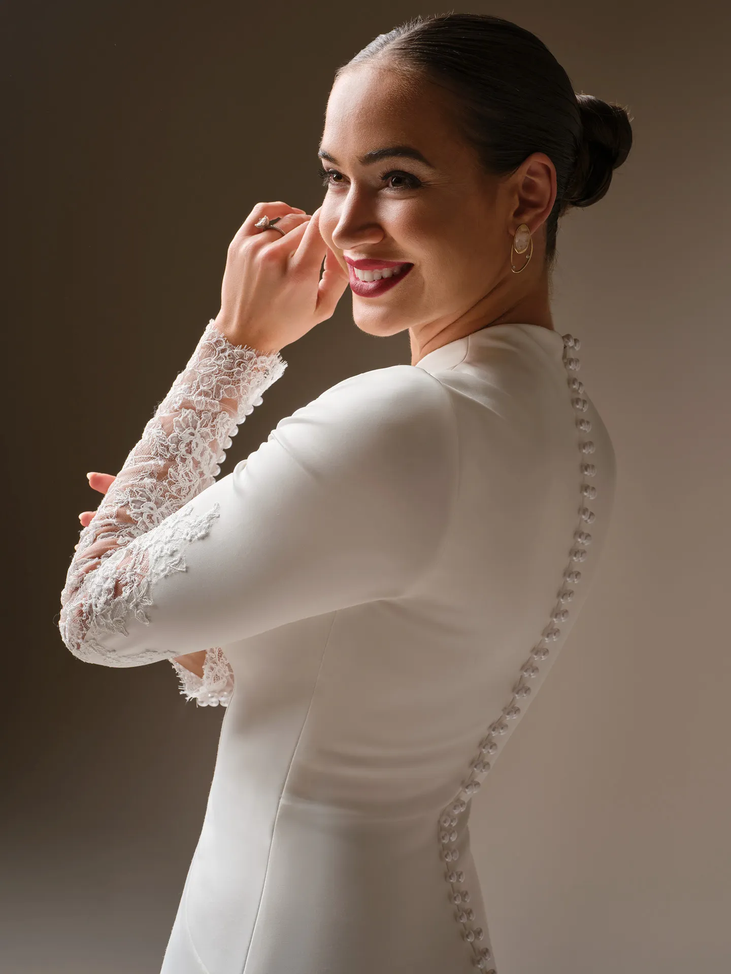 Sottero and Midgley Lovai, side view, lace sleeves, button detail.