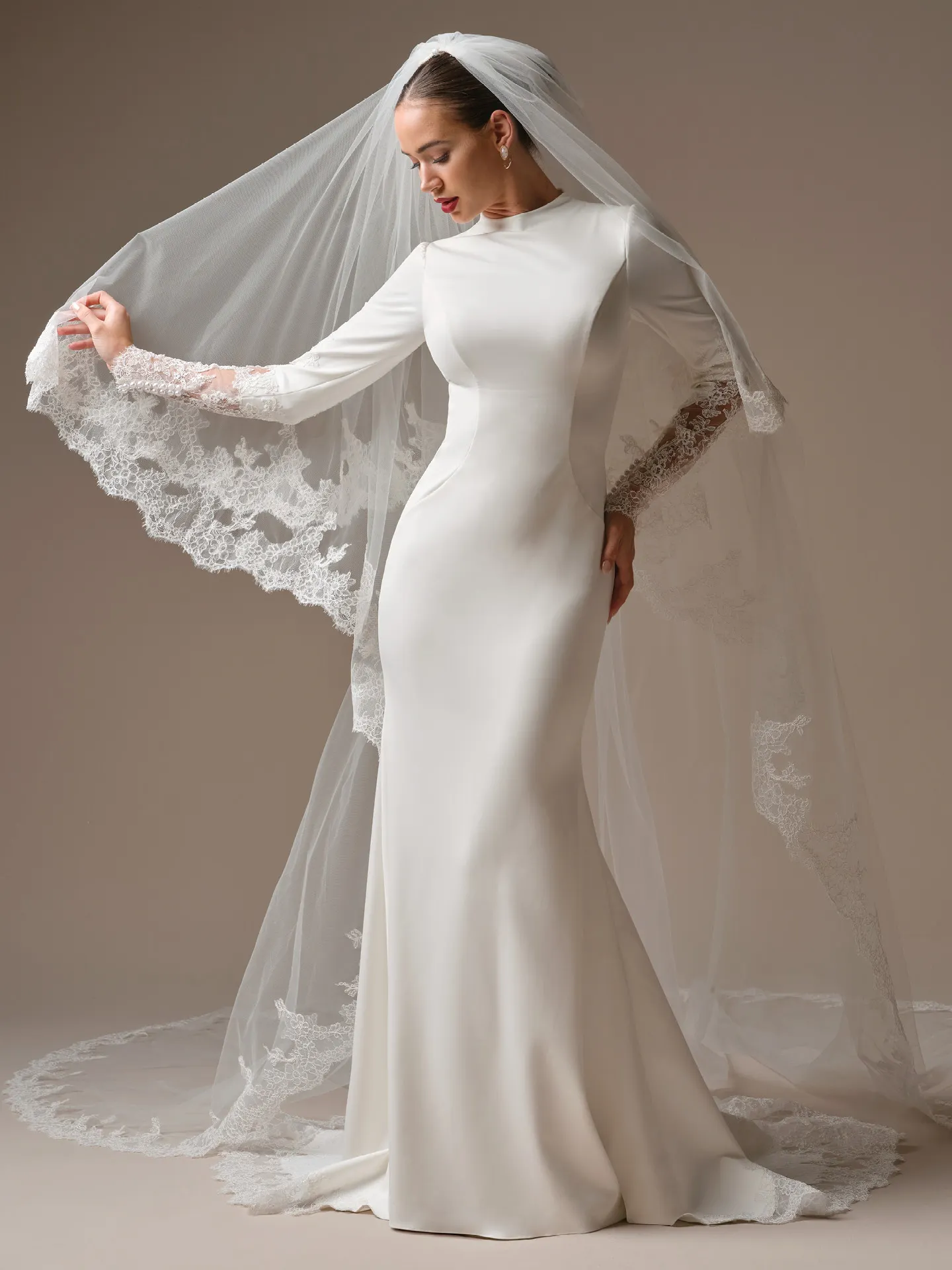 Sottero and Midgley Lovai, front view satin sheath wedding dress with lace sleeves and veil.