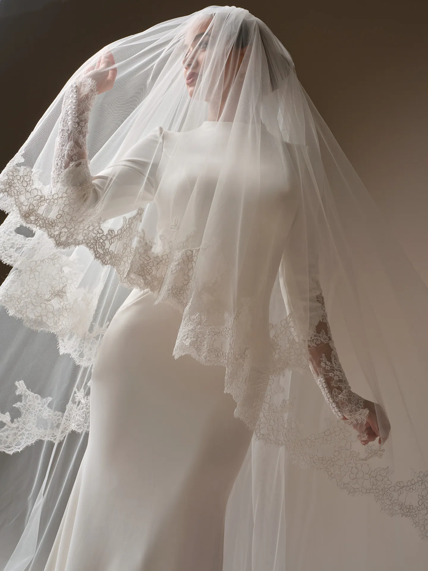 Sottero and Midgley Lovai, front view satin sheath wedding dress with lace veil.