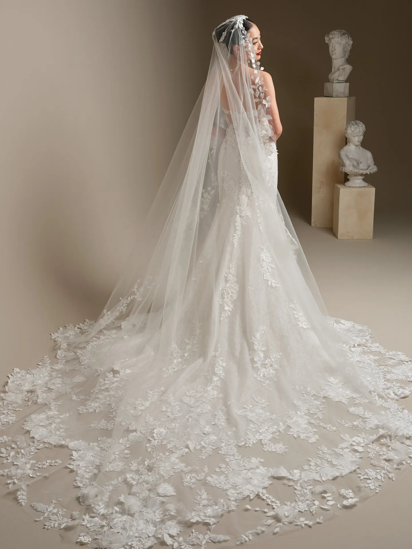 Sottero and Midgley Rashida, back view lace fit-and-flare wedding dress.