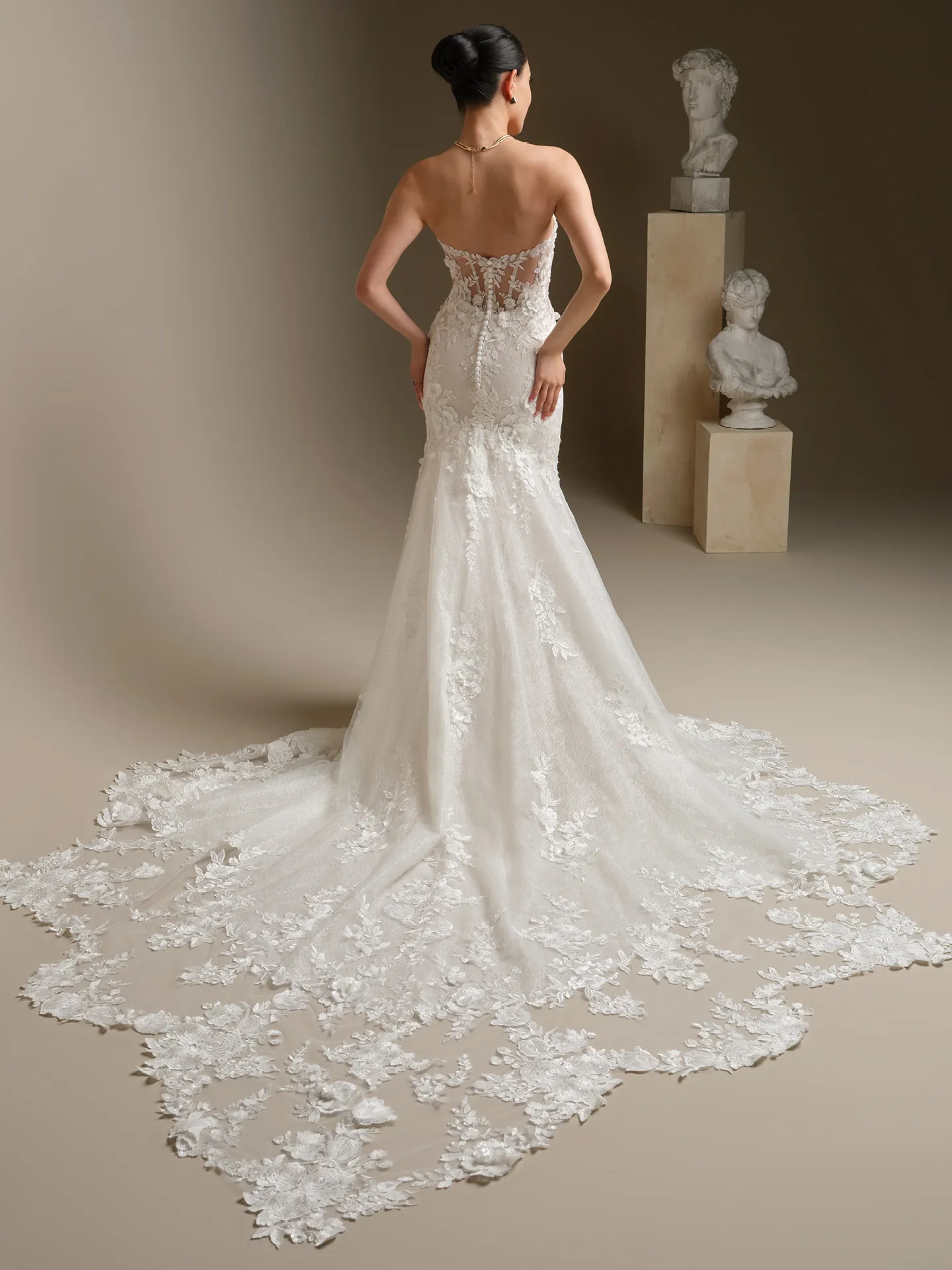 Sottero and Midgley Rashida, back view beaded lace fit-and-flare dress.