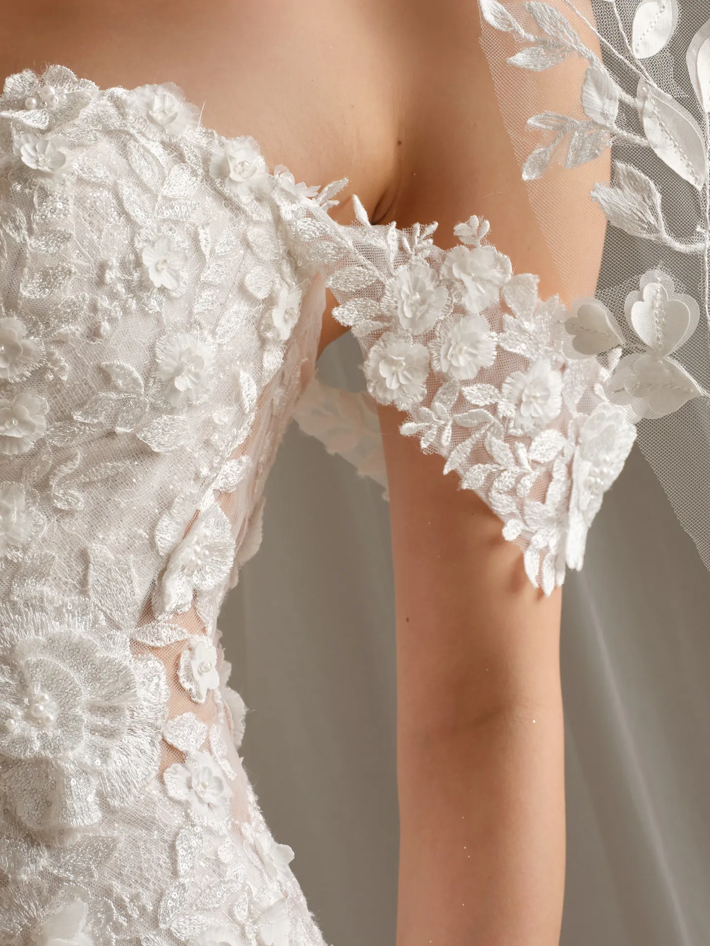 Sottero and Midgley Rashida lace detail with 3-D floral cap-sleeves.