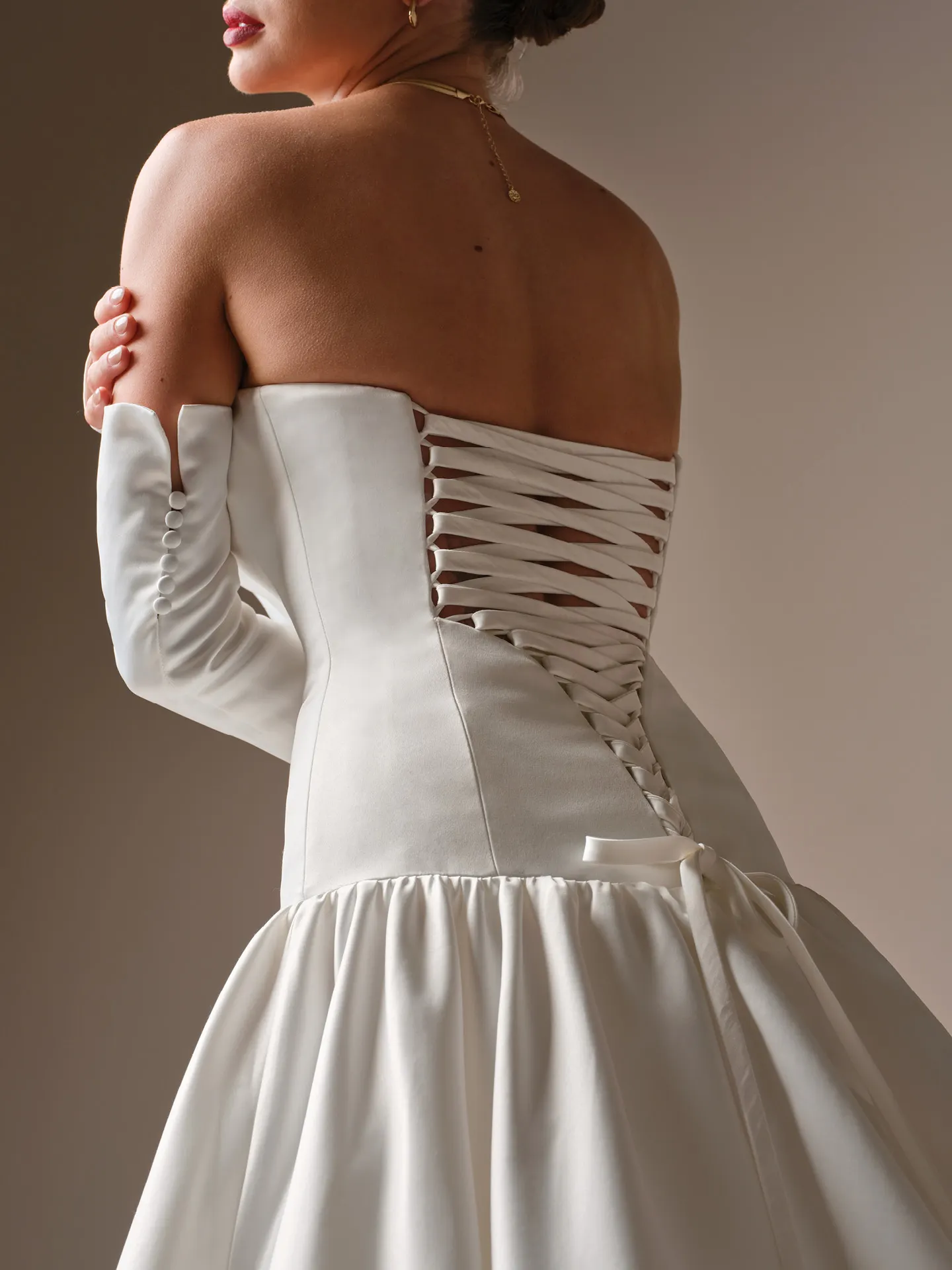 Sottero and Midgley Tokyo, back view strapless satin lace-up corset ballgown dress.