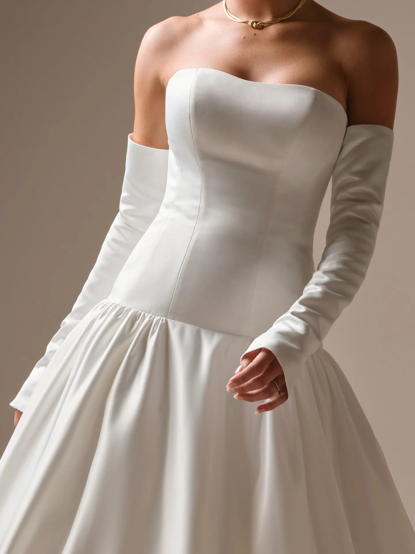 Sottero and Midgley Tokyo, front view fitted satin gown with long sleeves.