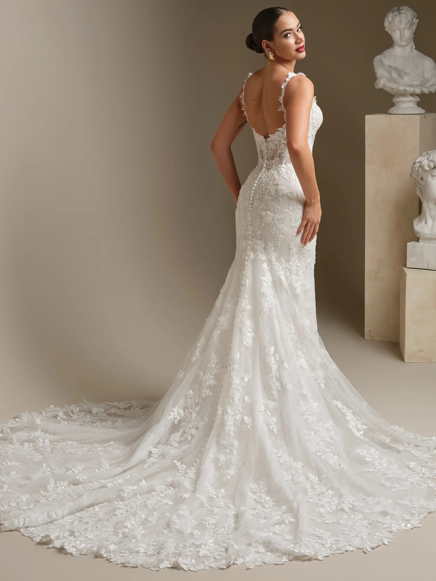Sottero and Midgley West, back view lace fit-and-flare wedding dress.
