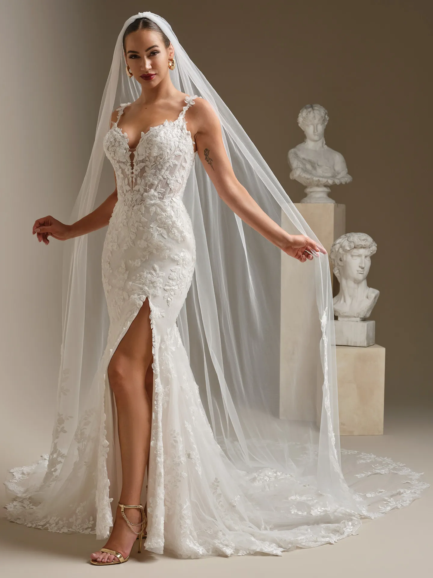Sottero and Midgley lace sheath dress with cathedral veil, front view.