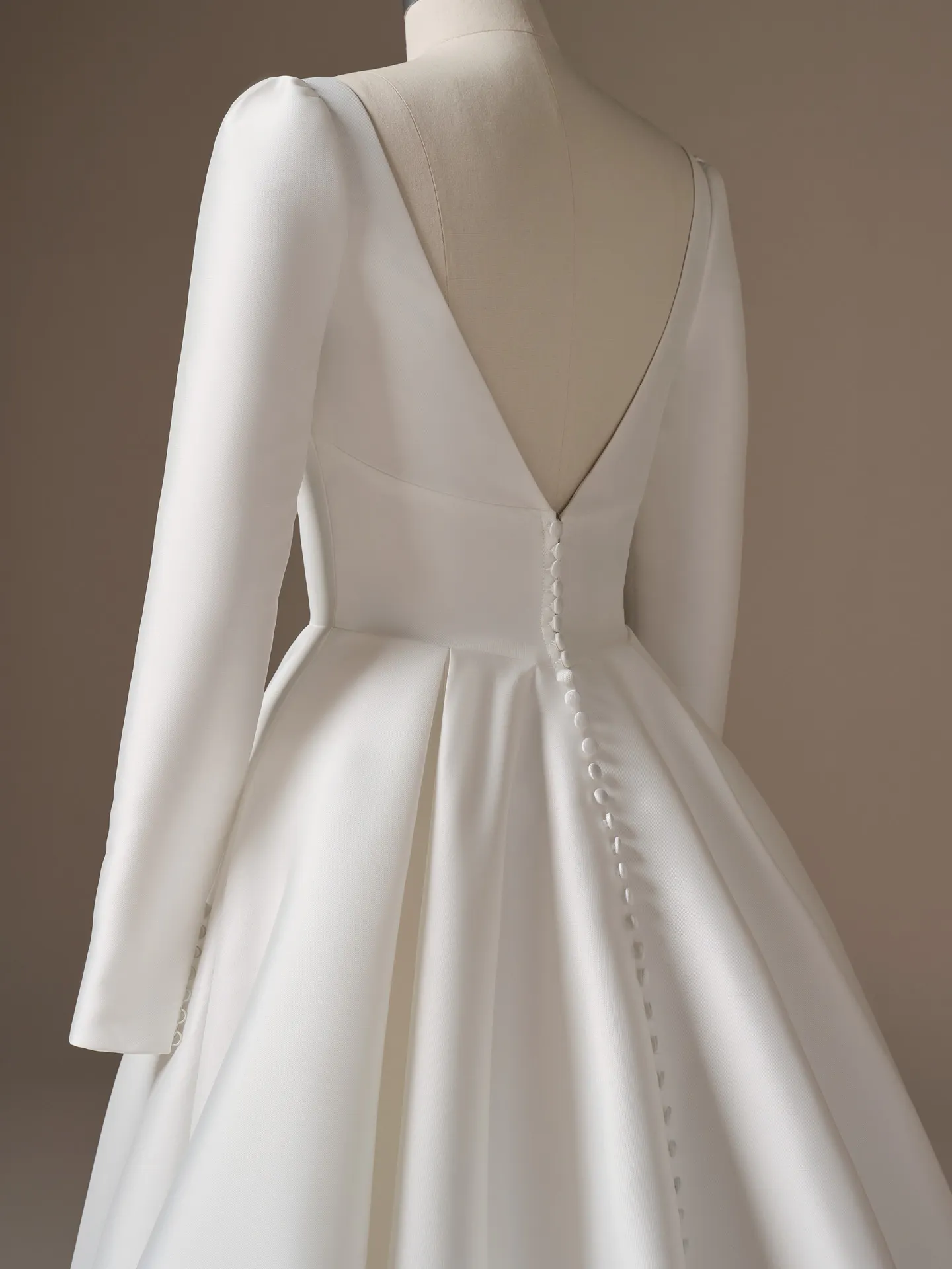 Maggie Sottero Galina, back view with V-back and buttons down A-line wedding dress.