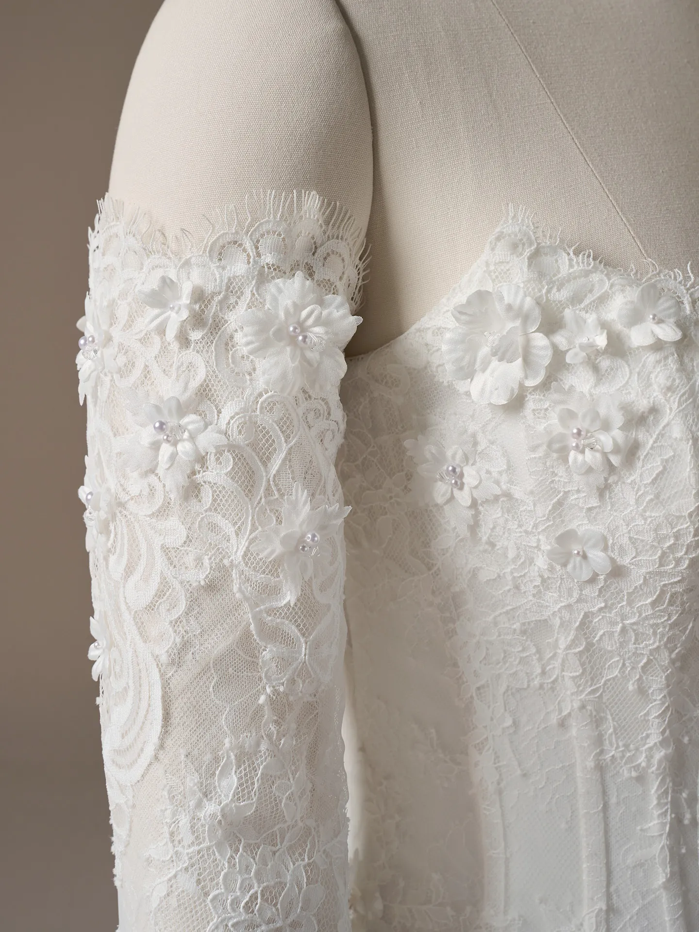 Maggie Sottero Kitaro lace detail with 3D floral appliques.