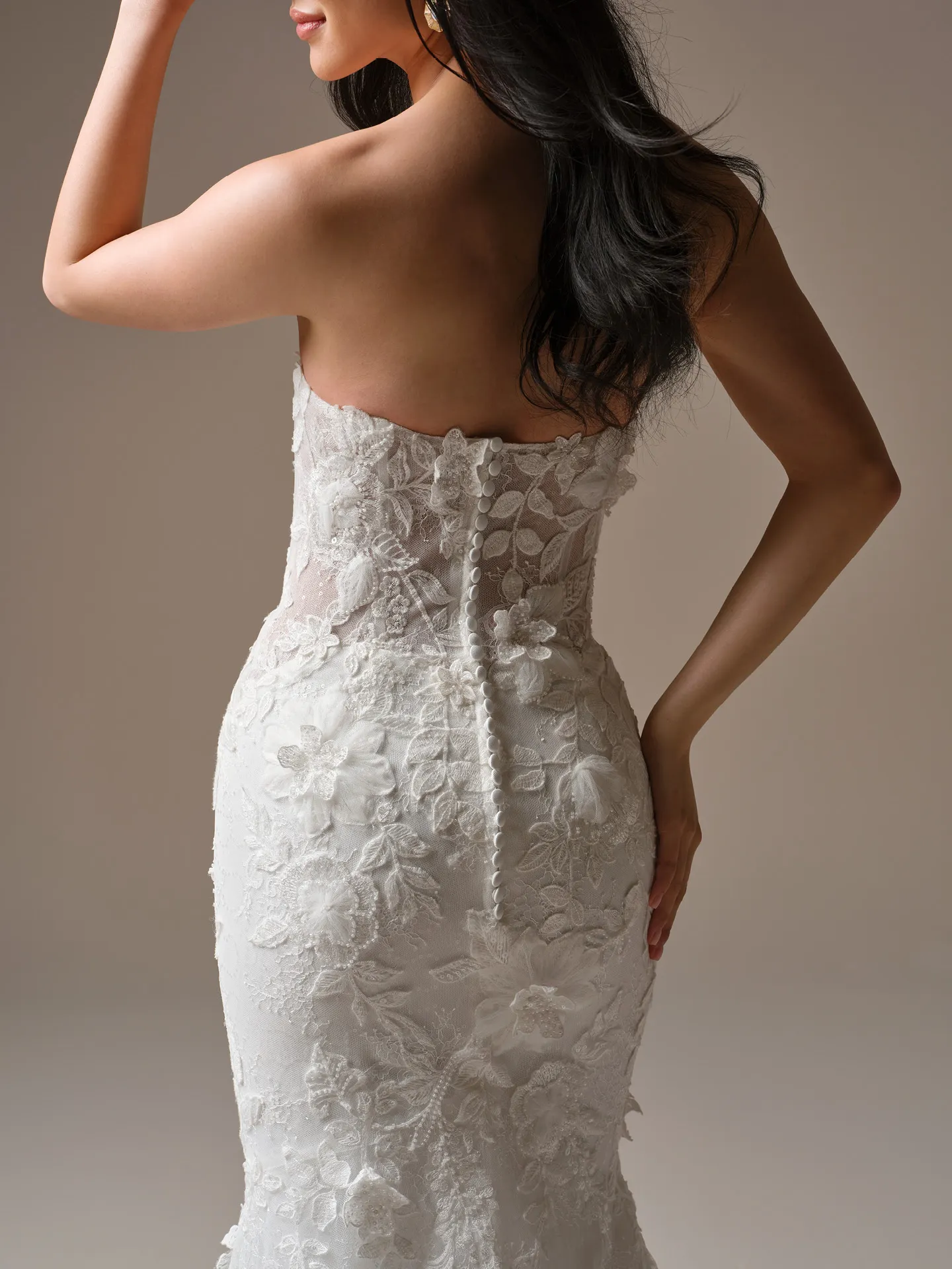 Laurie, back view fit-and-flare wedding dress with lace details Maggie Sottero.
