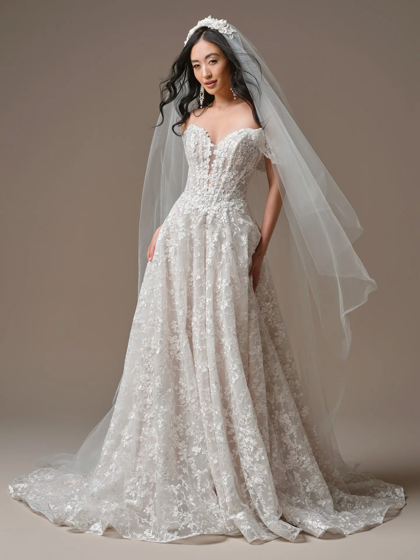 Maggie Sottero Memphis A-Line, front view with lace details and plunging neckline.