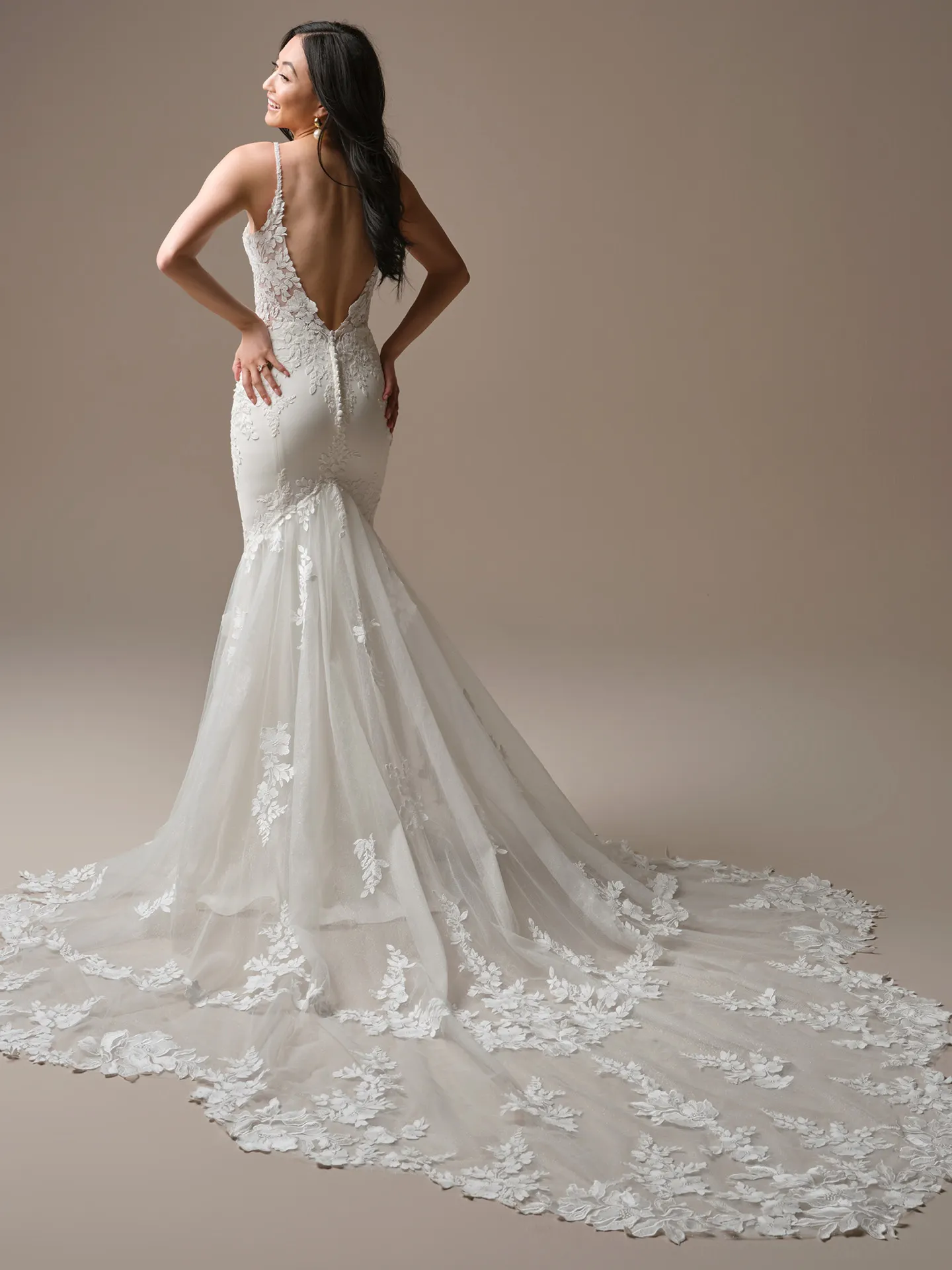 Maggie Sottero Noelle, back view lace sheath wedding dress with long train.
