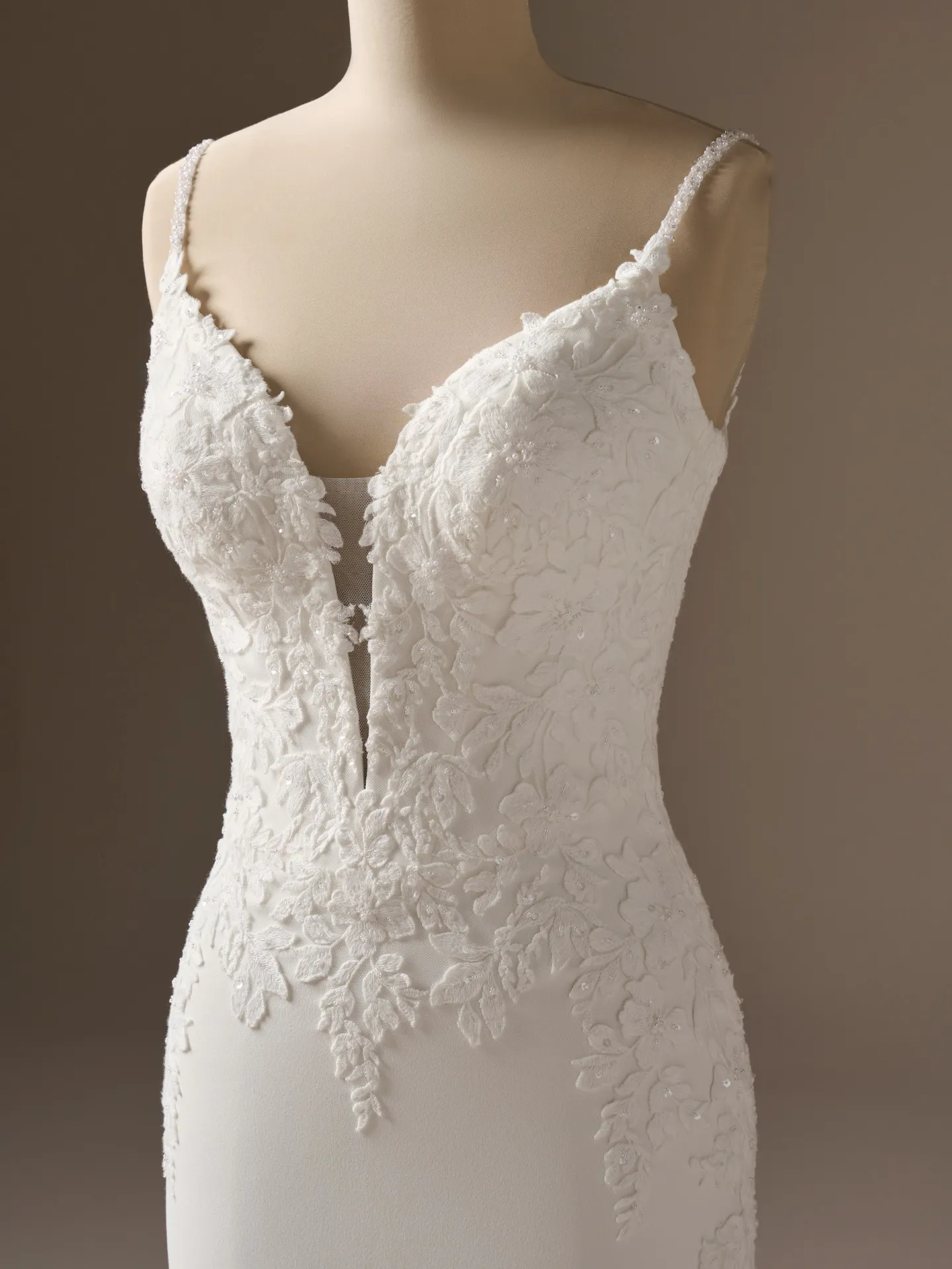 Maggie Sottero Noelle, front view beaded lace sheath wedding dress with floral details.