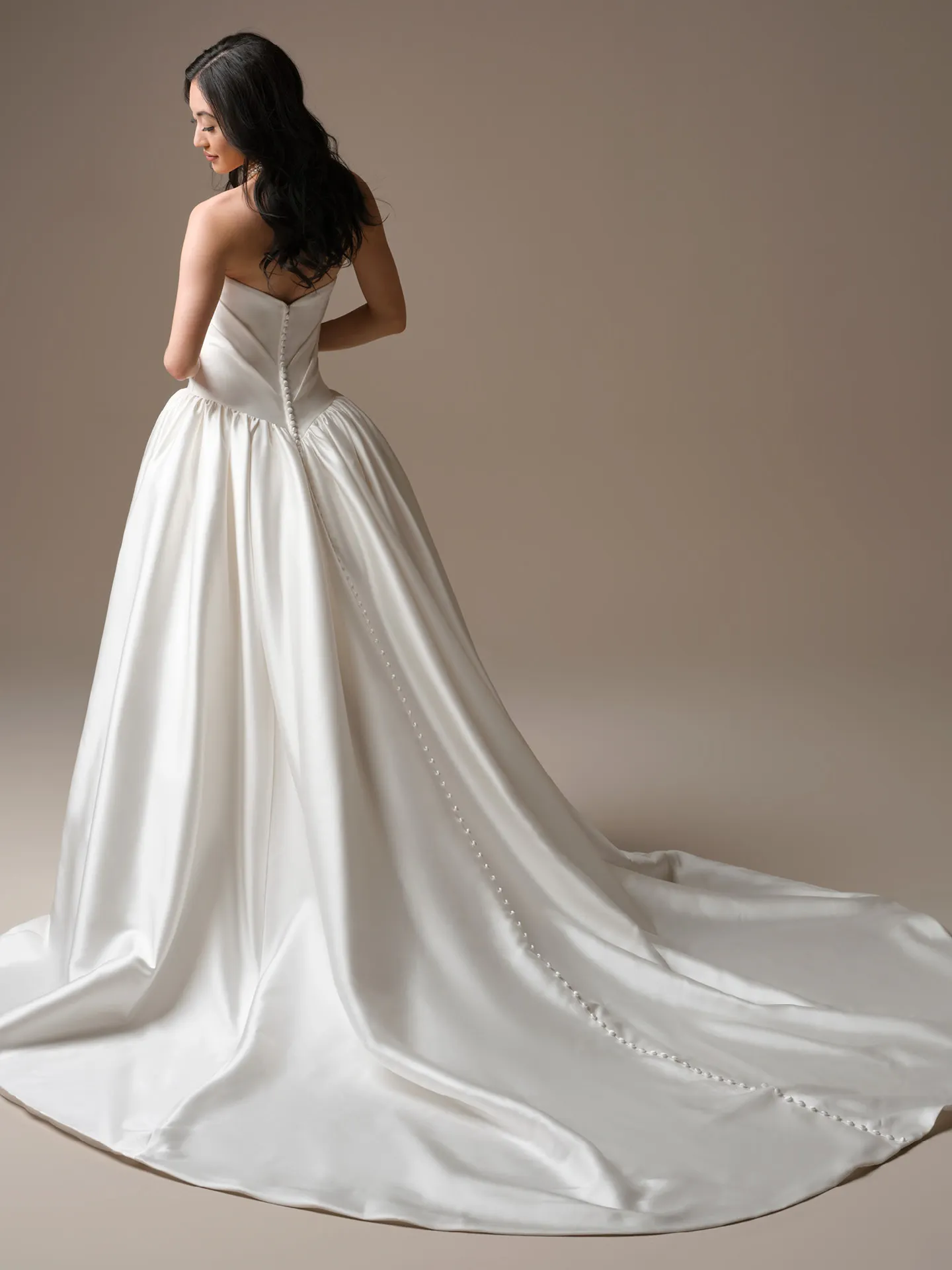 Maggie Sottero Sylvana Draped Satin A-Line, back view with button detail Maggie Sottero.