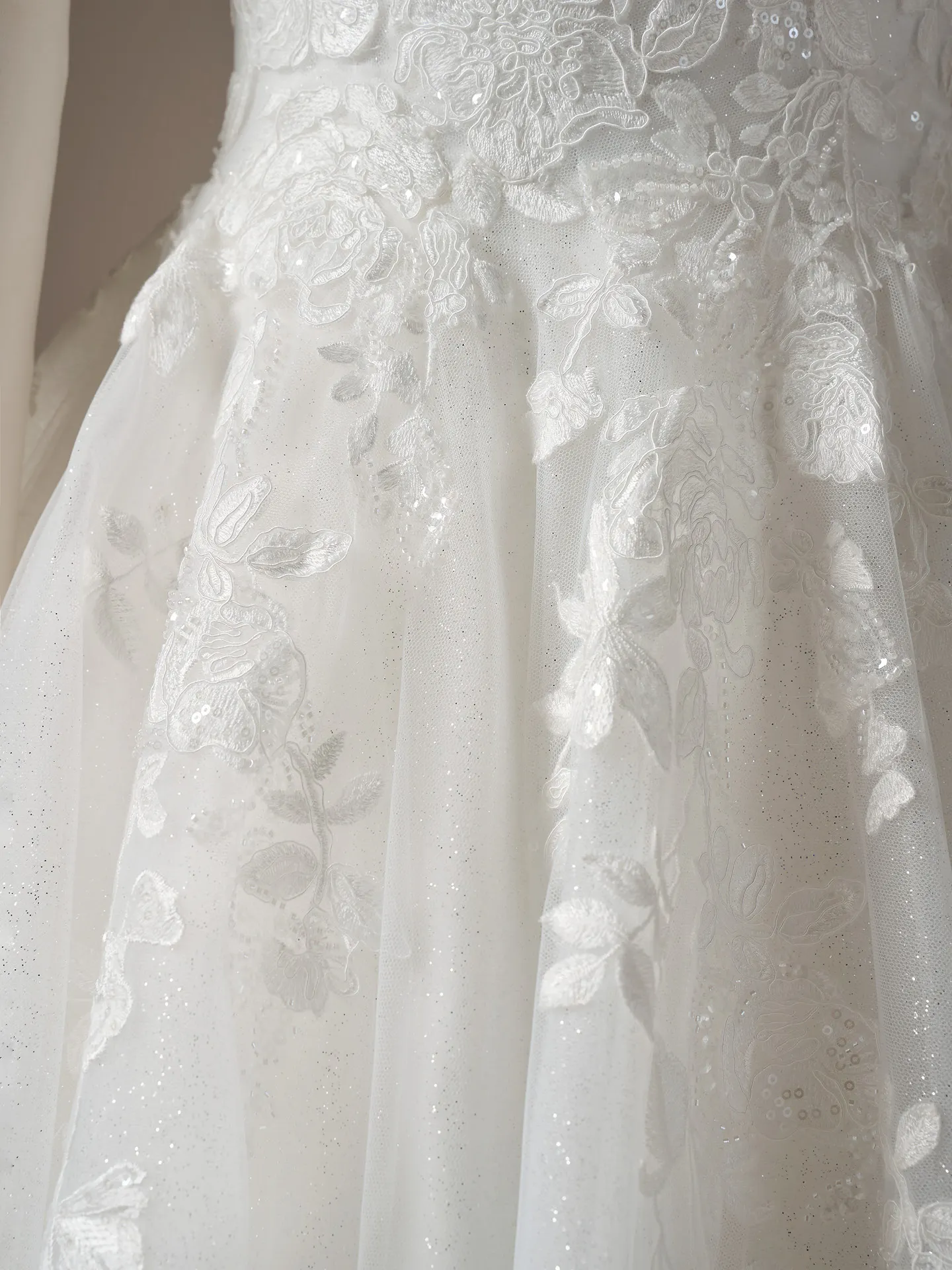 Maggie Sottero Verina off-shoulder lace detail close-up Maggie Sottero.