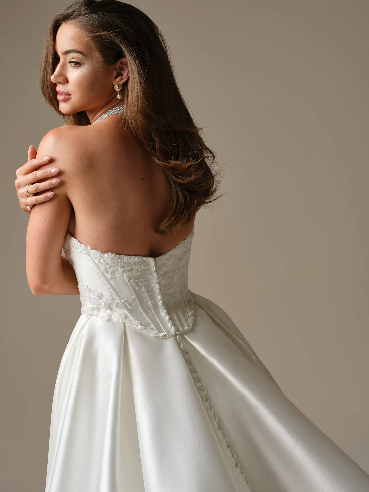 Maggie Sottero Wyntelle, back view showing lace and button detail.