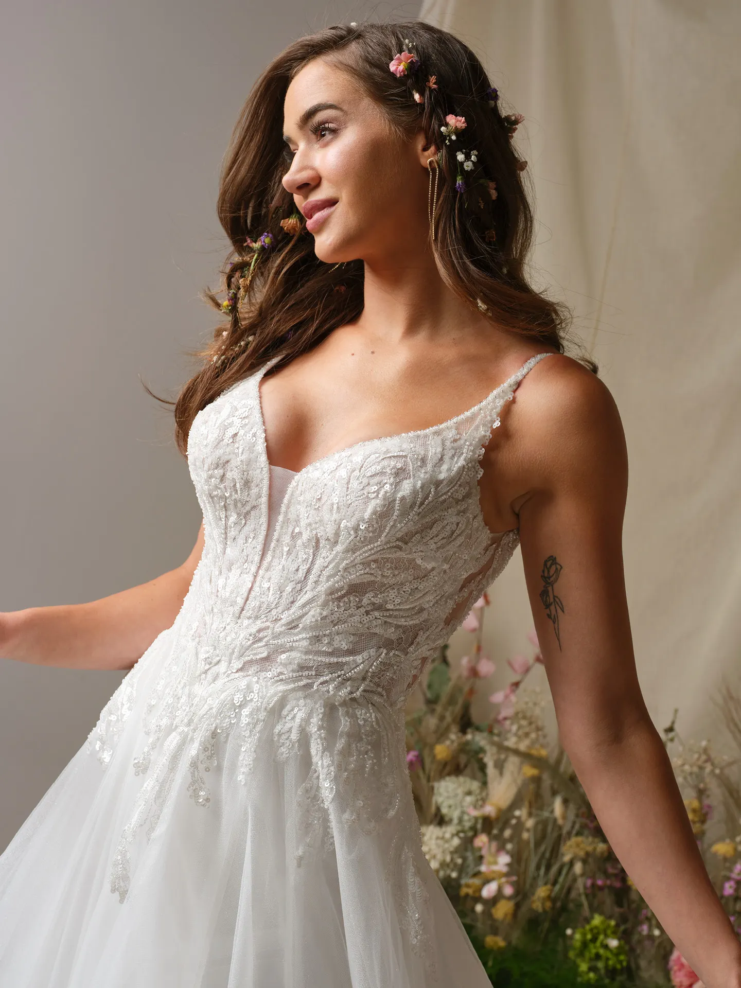 Rebecca Ingram Valarie front view, lace A-line dress with plunging V-neck and floral accents