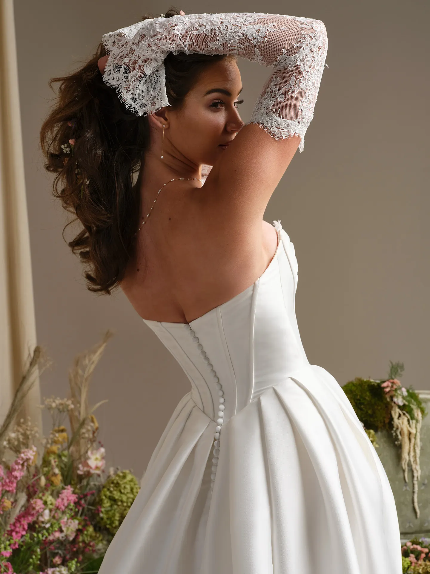 Rebecca Ingram Zorina back view, lace sleeves, mikado ballgown, floral background