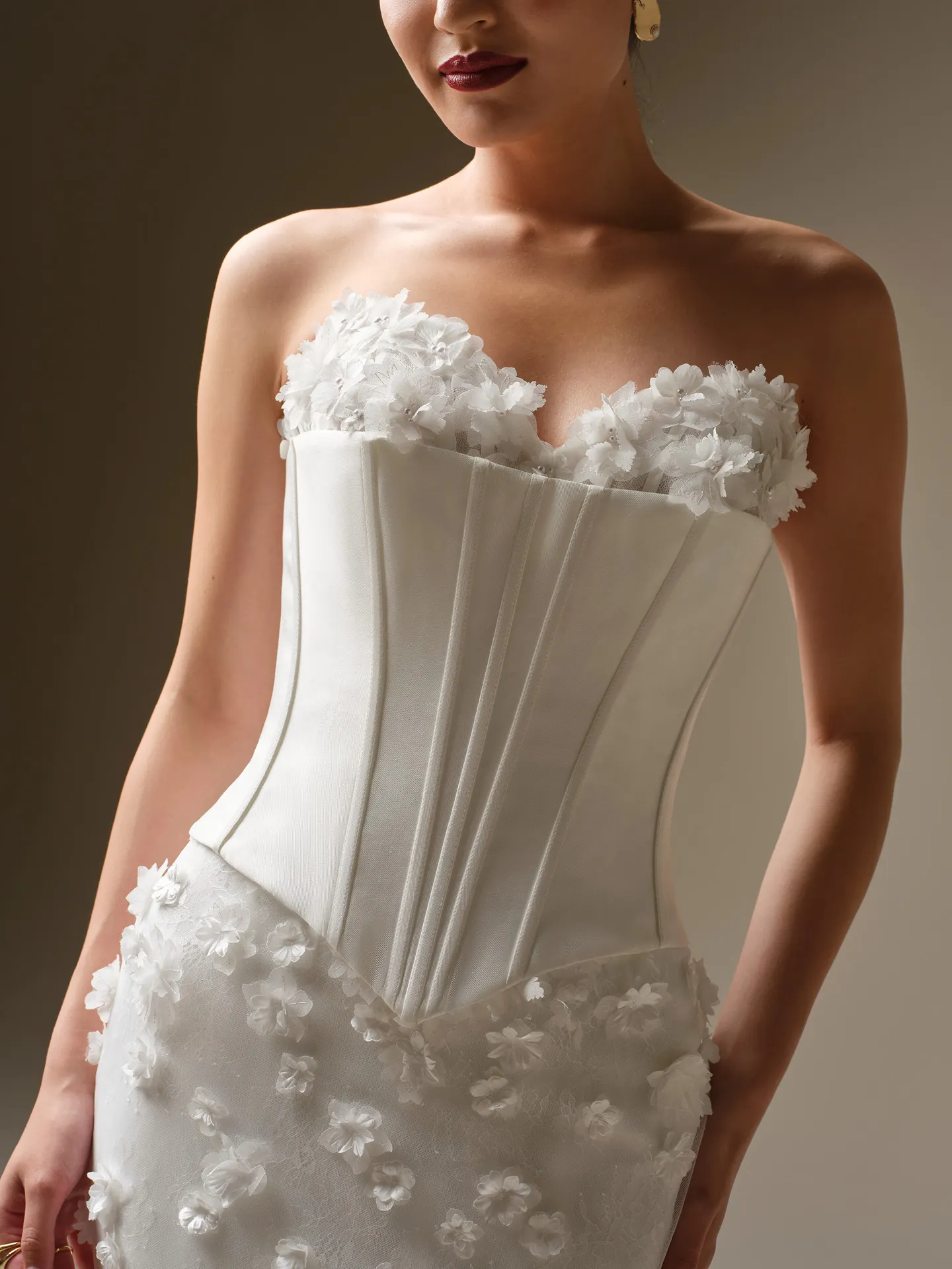 Maggie Sottero Akari fit-and-flare wedding dress front view with 3D flowers.