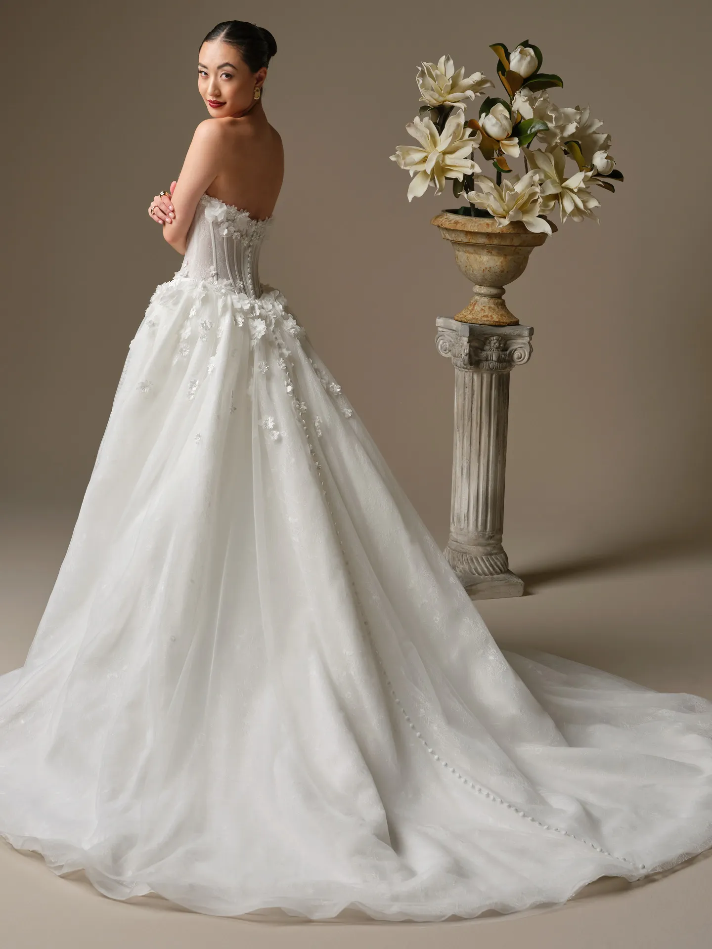 Maggie Sottero Akari, fit-and-flare with 3-D flowers,, back view.