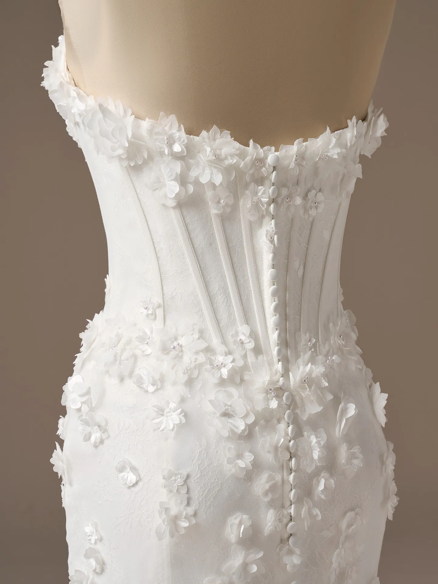 Maggie Sottero Akari, back view, fit-and-flare, 3D flowers, button detail.