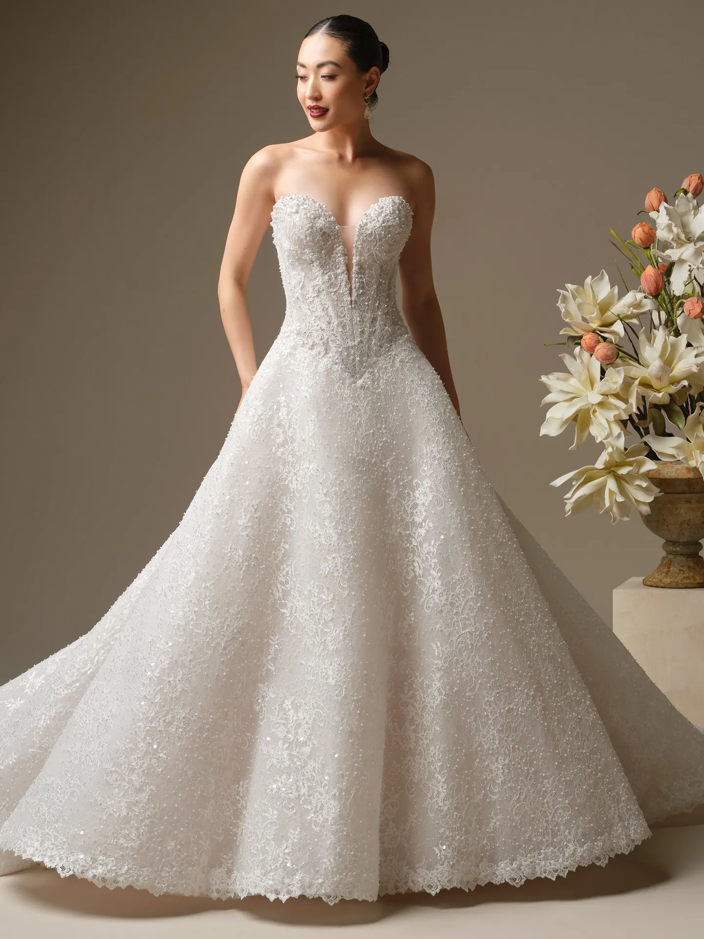 Maggie Sottero Angelica, front view A-line beaded wedding dress with floral details.