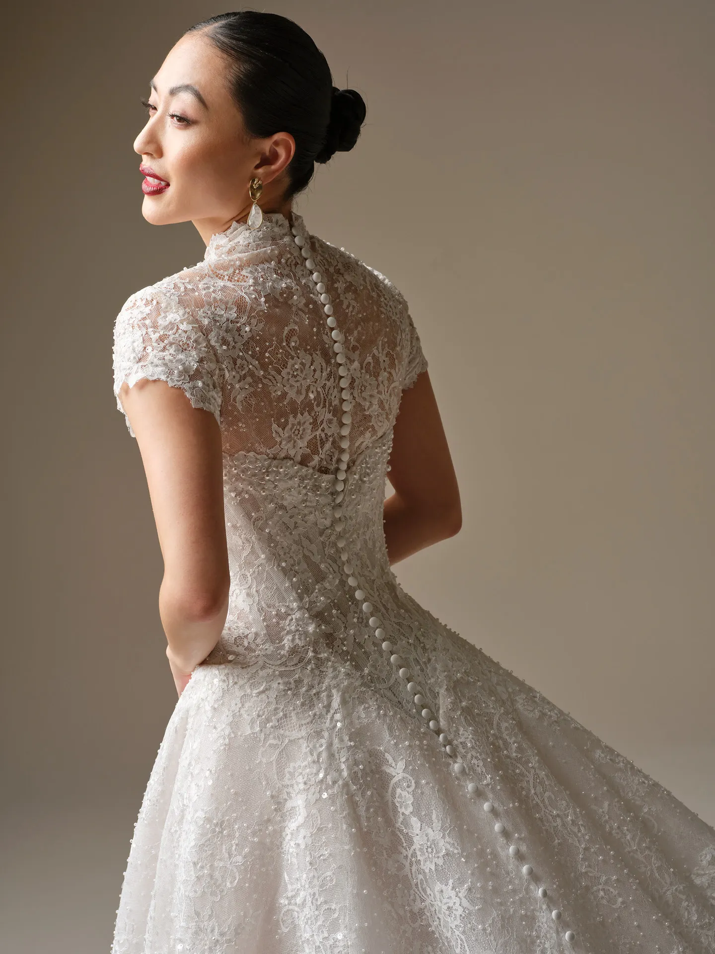 Maggie Sottero Angelica, back view, lace A-line wedding dress with buttons.