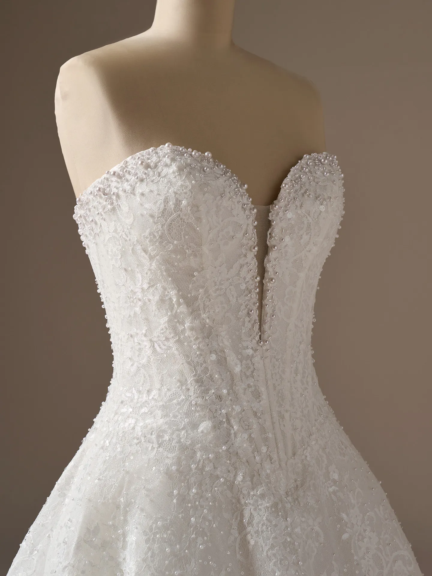 Maggie Sottero Angelica beaded A-line dress, side view.
