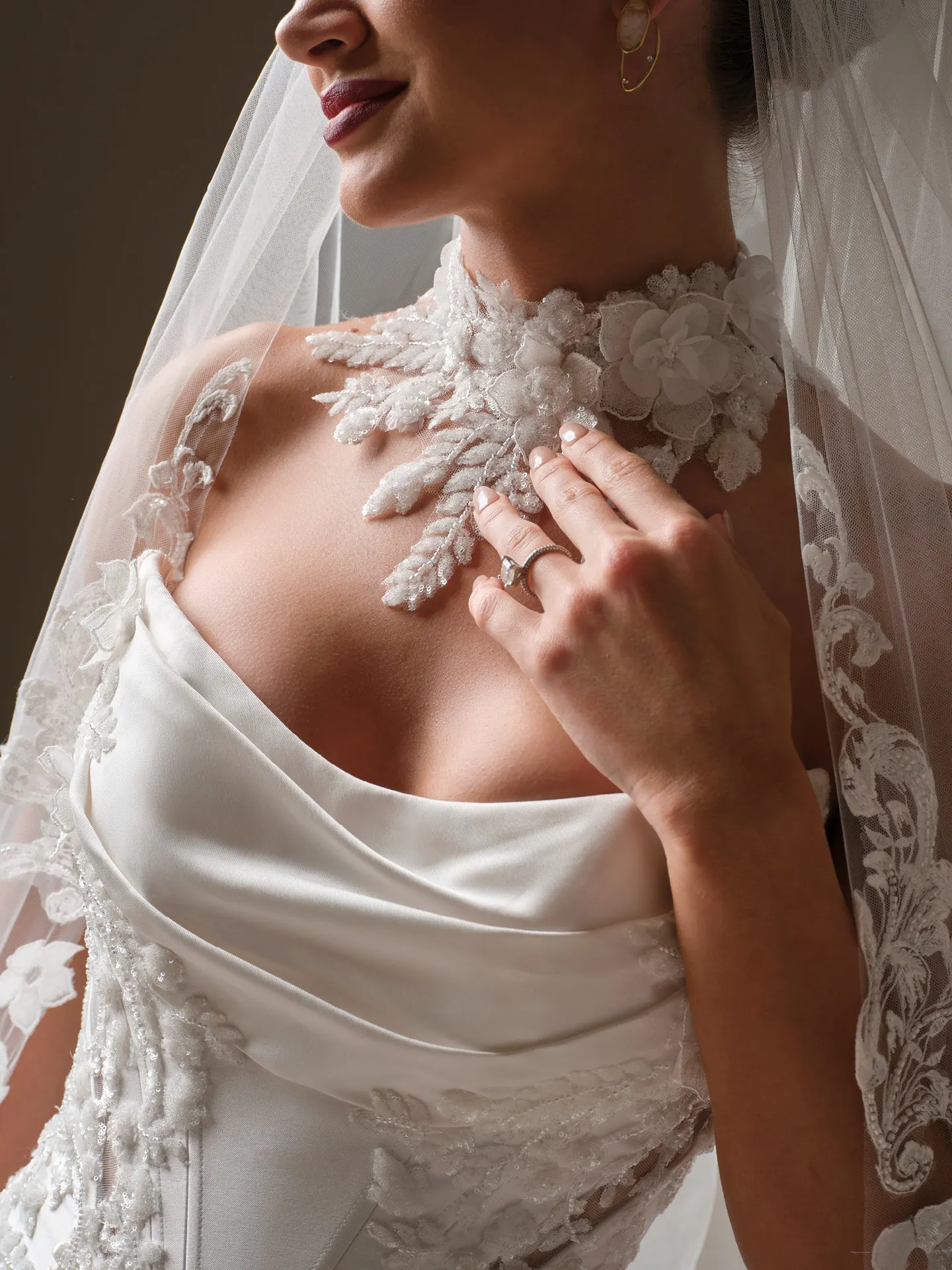 Maggie Sottero Burke fit-and-flare close-up with lace detail.
