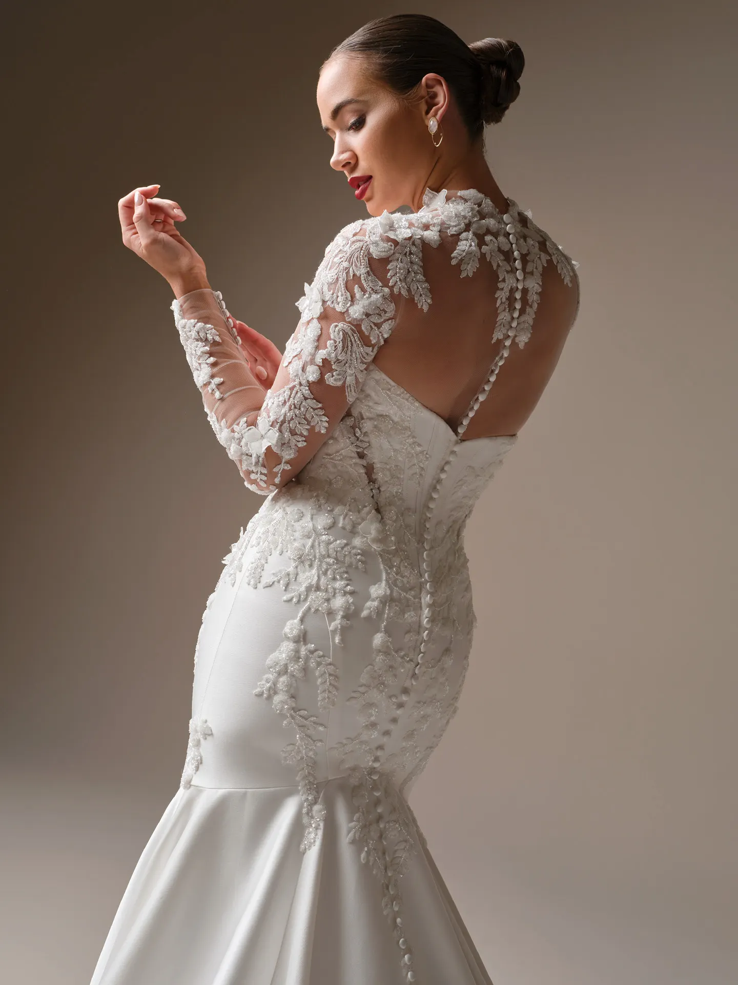 Maggie Sottero Burke lace fit-and-flare, back view.