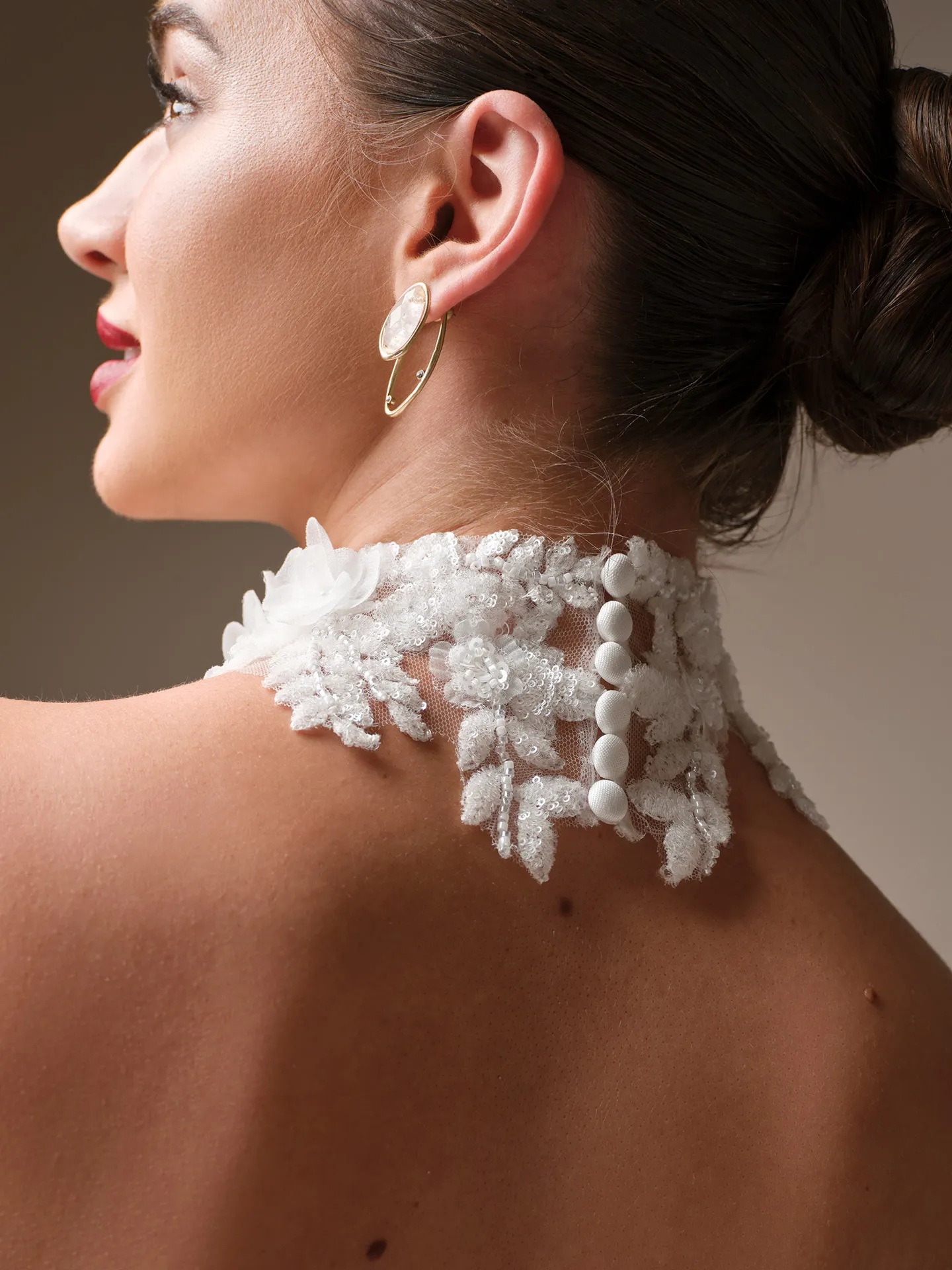 Maggie Sottero Burke lace collar detail with button accents,, side view.