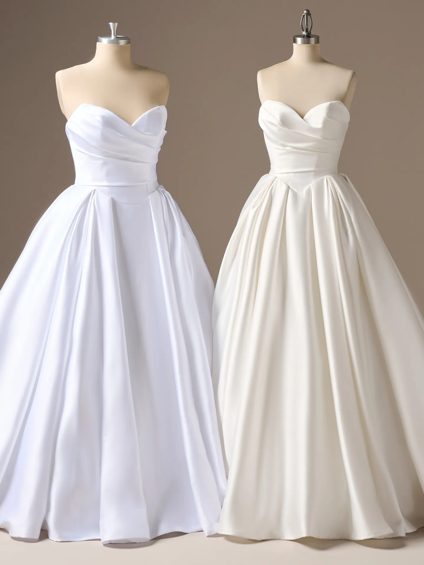Sottero and Midgley Elias strapless satin ballgown on mannequins, front view.