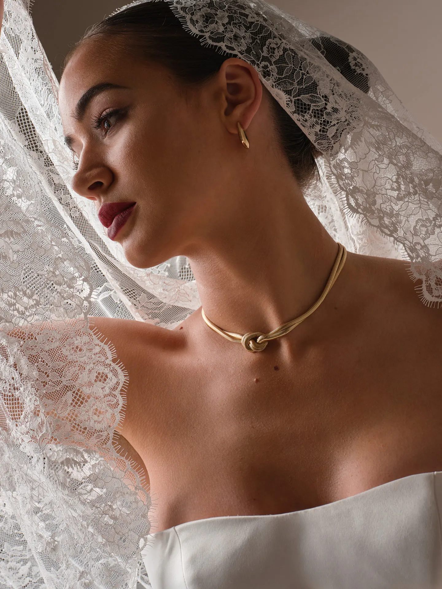 Sottero and Midgley Tokyo, side view with lace veil and gold necklace.