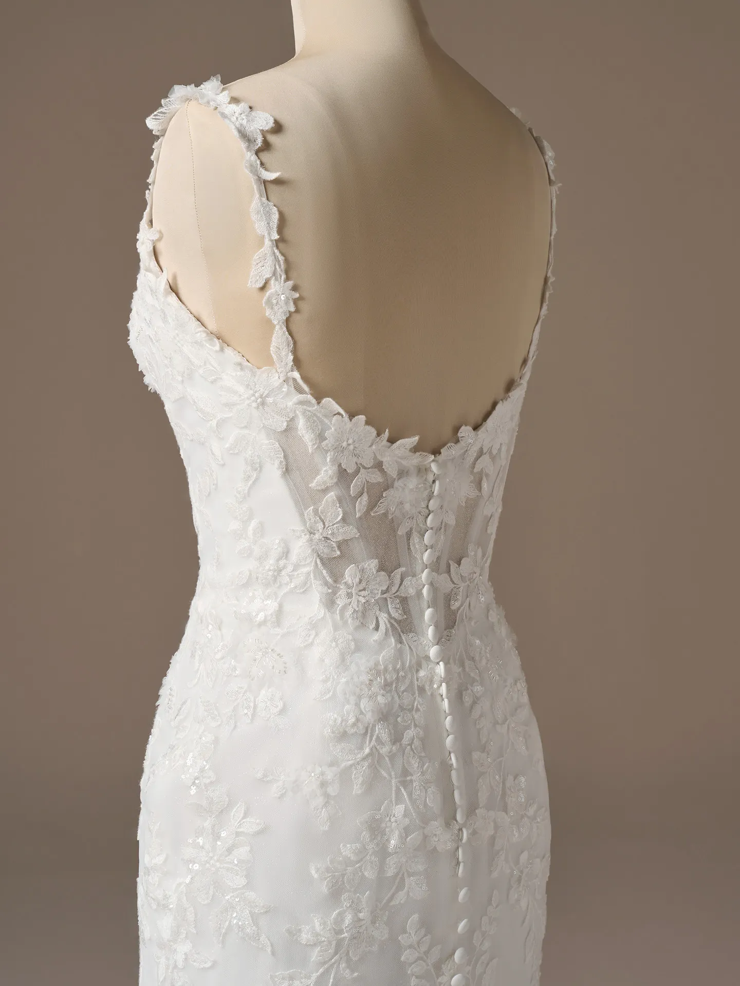 Sottero and Midgley West, back view lace fit-and-flare wedding dress.