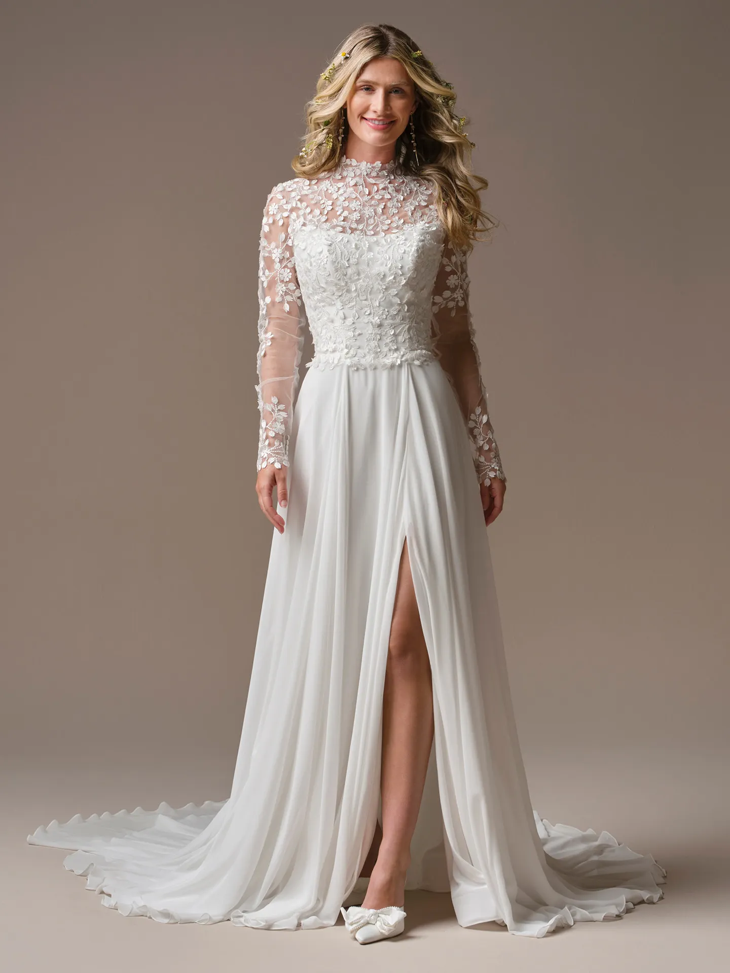 Rebecca Ingram Georgina front view -D lace jacket over sleek white gown with slit