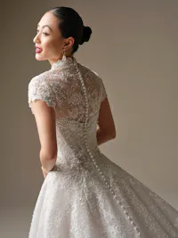 Angelica short sleeve illusion over lace jacket with pearl and bead accents