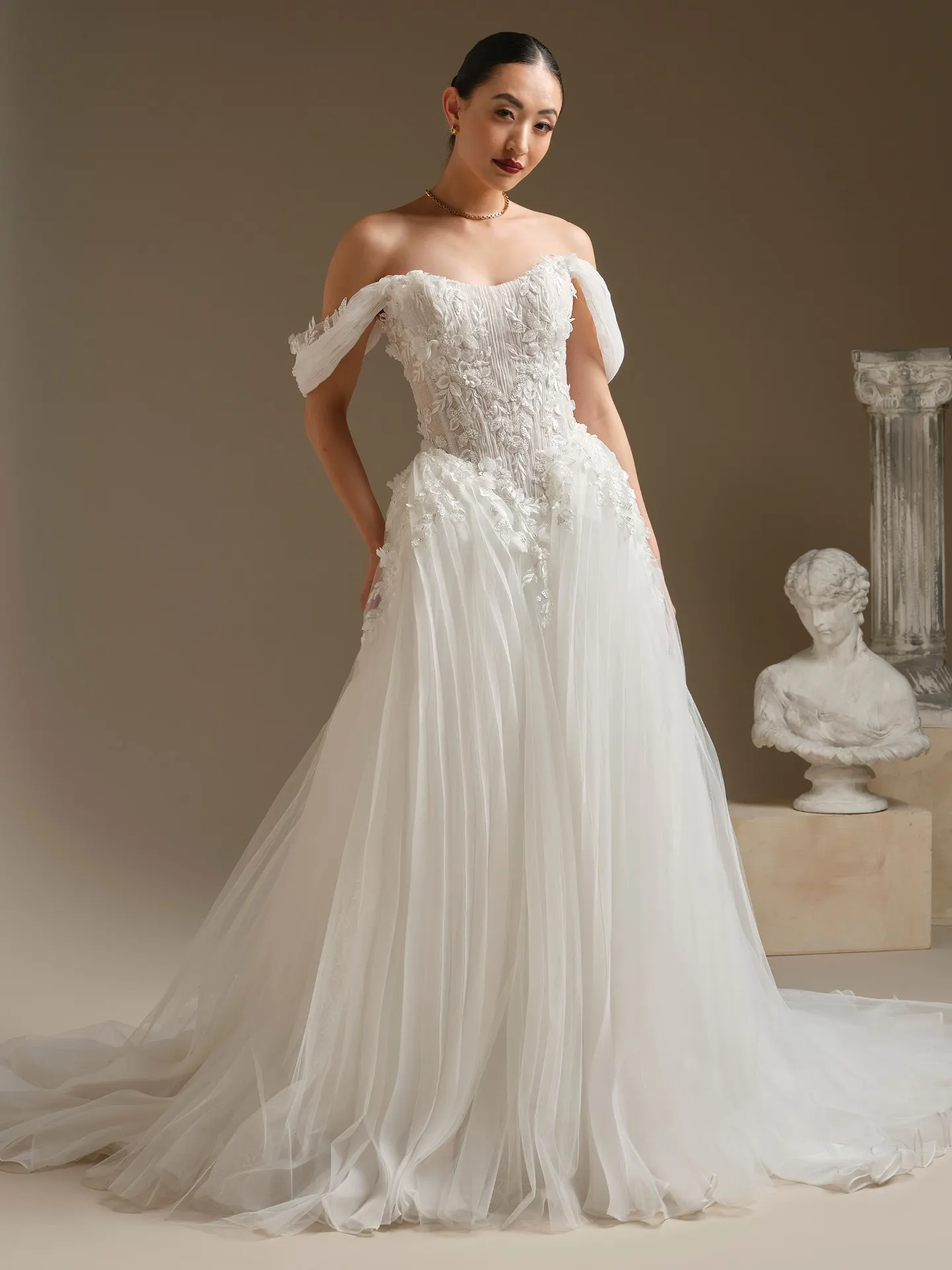Sottero and Midgley Jayna organza cap-sleeves gown, front view bust and column in background.
