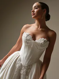 Kalinda Cartago satin cat eye bustier with beaded motifs and pearl string details