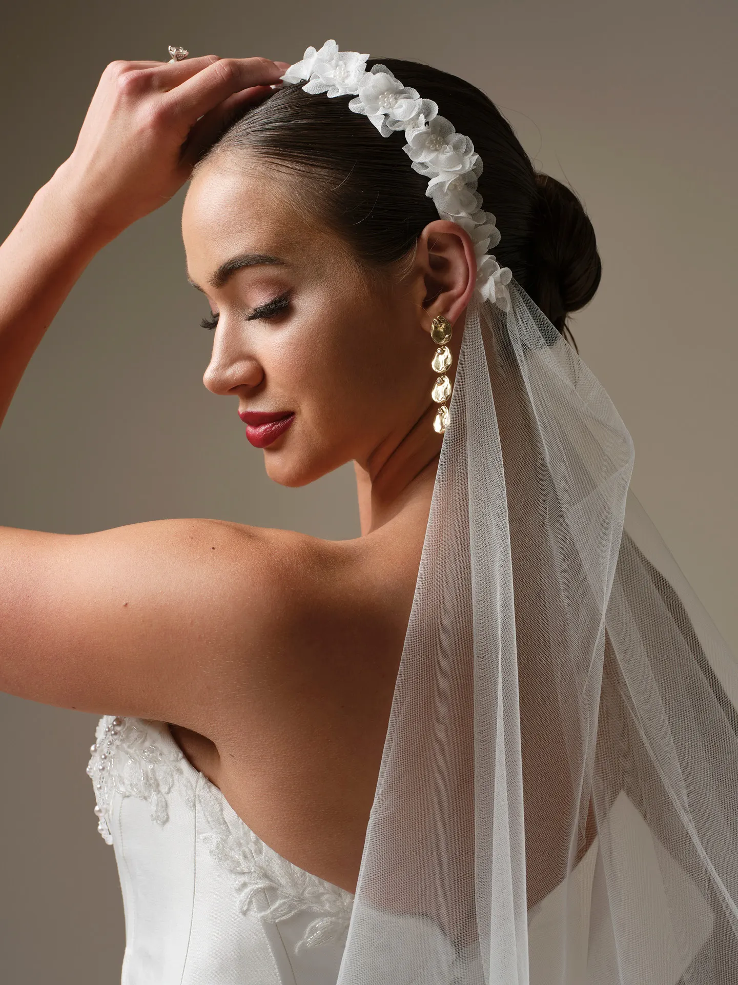 Sottero and Midgley Kalinda cathedral veil with 3-D flower headband, side view.